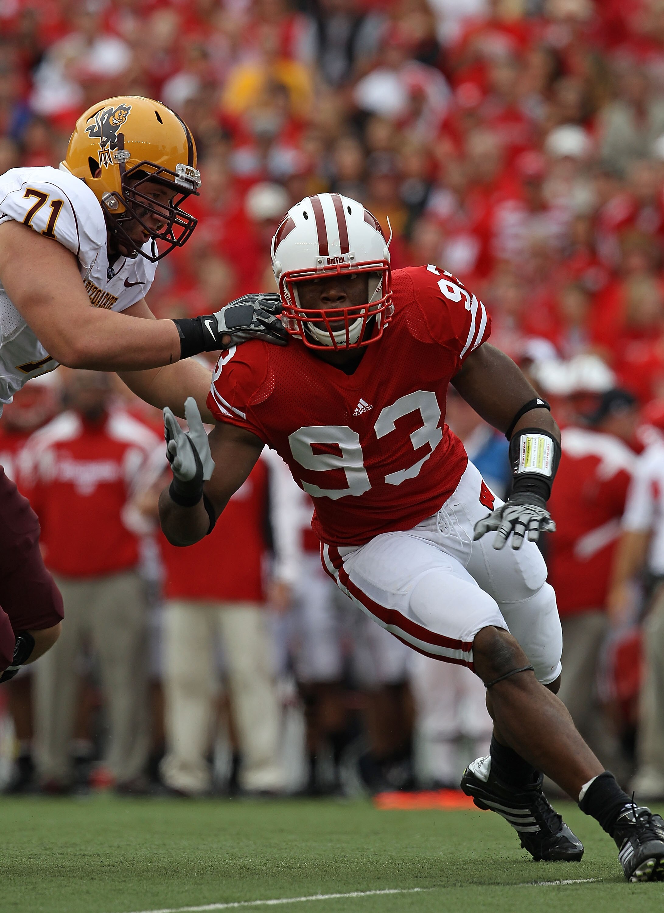 MADISON, WI - SEPTEMBER 18: Louis Nzegwu #93 of the Wisconsin Badgers rushes against Brice Schwab #71 of the Arizona State Sun Devils at Camp Randall Stadium on September 18, 2010 in Madison, Wisconsin. Wisconsin defeated Arizona State 20-19.  (Photo by J