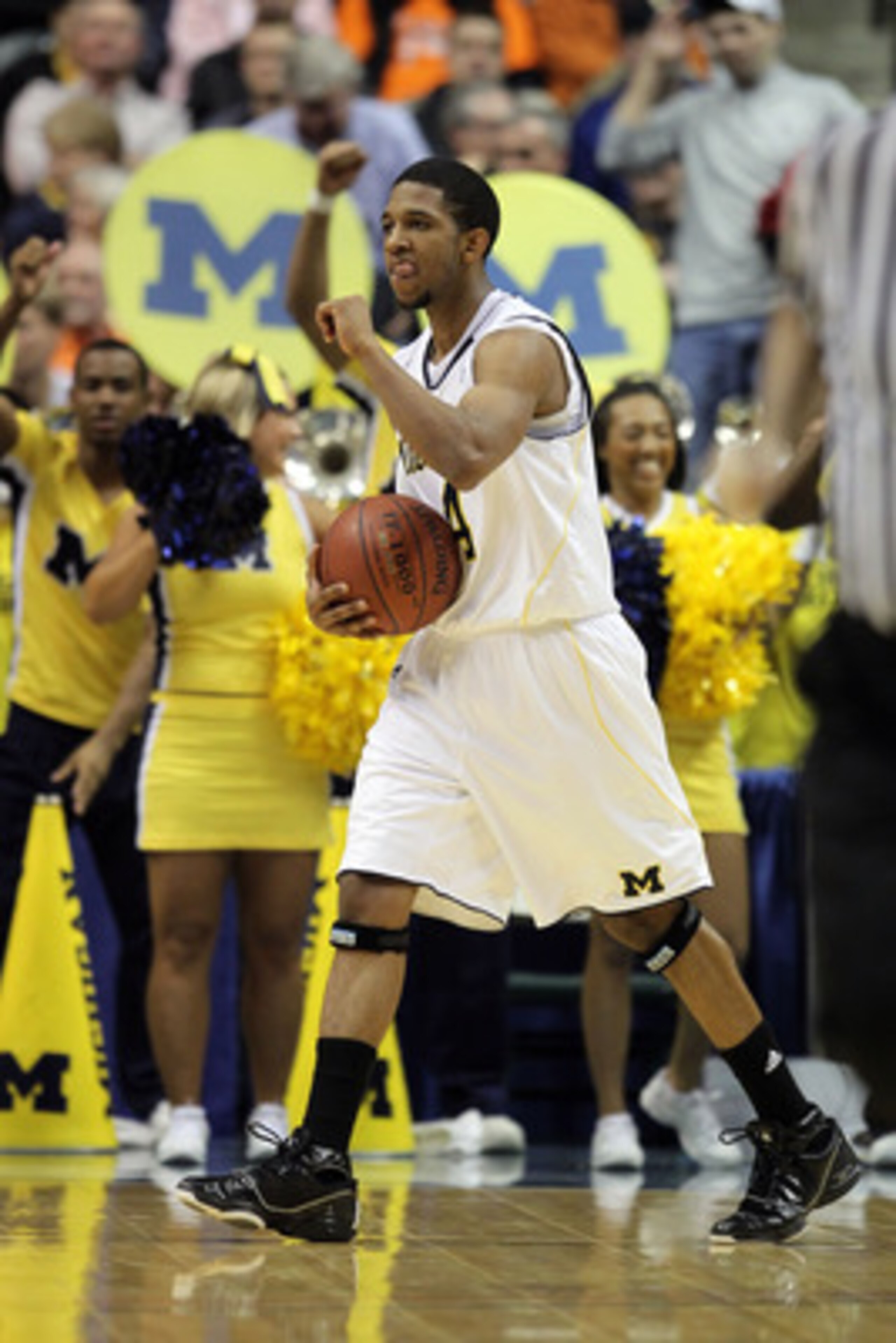 INDIANAPOLIS, IN - MARCH 11:  Darius Morris #4 of the Michigan Wolverines reacts against the Illinois Fighting Illini during the quarterfinals of the 2011 Big Ten Men's Basketball Tournament at Conseco Fieldhouse on March 11, 2011 in Indianapolis, Indiana