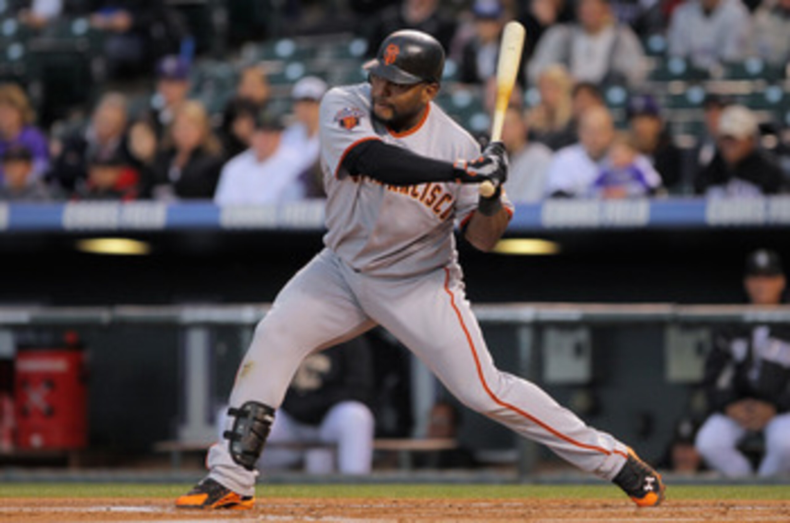 DENVER, CO - APRIL 19:  Pablo Sandoval #48 of the San Francisco Giants begins his swing as he connects on a three run homerun off of starting pitcher Ubaldo Jimenez #38 of the Colorado Rockies in the first inning at Coors Field on April 19, 2011 in Denver