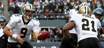 SEATTLE, WA - JANUARY 08: Drew Brees #9 and Julius Jones #21 of the New Orleans Saints run a play against the Seattle Seahawks during the 2011 NFC wild-card playoff game at Qwest Field on January 8, 2011 in Seattle, Washington. (Photo by Otto Greule Jr/ SEATTLE, WA - JANUARY 08: Drew Brees #9 and Julius Jones #21 of the New Orleans Saints run a play against the Seattle Seahawks during the 2011 NFC wild-card playoff game at Qwest Field on January 8, 2011 in Seattle, Washington. (Photo by Otto Greule Jr/