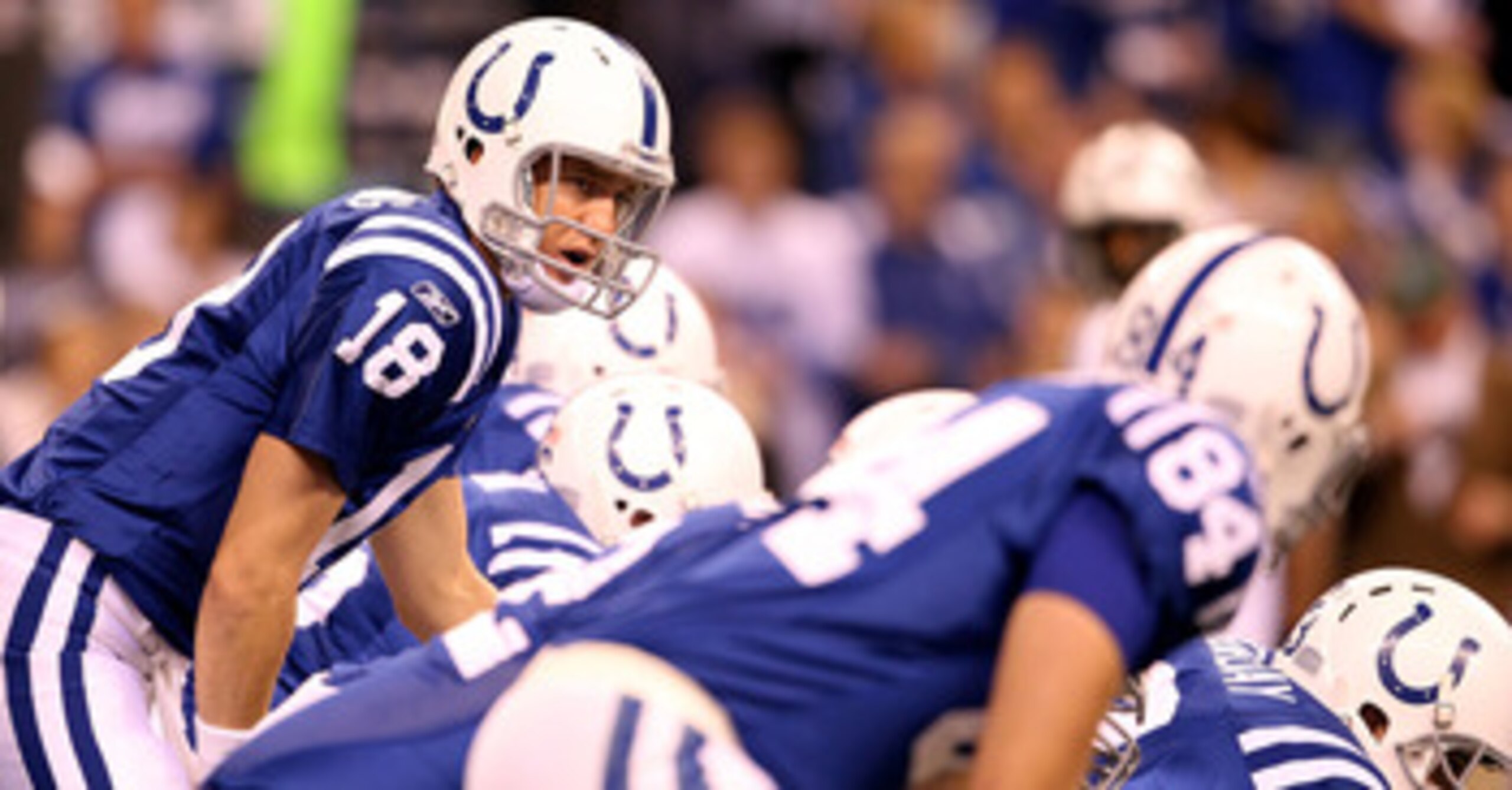 INDIANAPOLIS, IN - JANUARY 08:  Payton Manning #18 of the Indianapolis Colts calls out signals as he steps up to the line of scrimmage in the first quarter against the New York Jets during their 2011 AFC wild card playoff game at Lucas Oil Stadium on Janu
