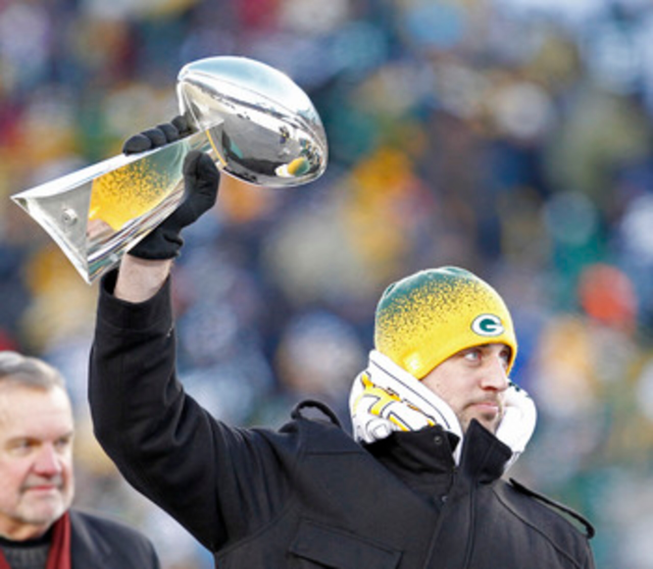 GREEN BAY, WI - FEBRUARY 08:  Green Bay Packers quarterback Aaron Rodgers hoists the Lombardi Trophy during the Packers victory ceremony at Lambeau Field on February 8, 2011 in Green Bay, Wisconsin.  (Photo by Matt Ludtke/Getty Images)