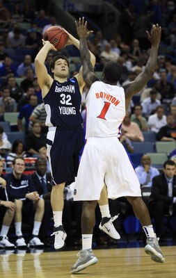 NEW ORLEANS, LA - MARCH 24:  Jimmer Fredette #32 of the Brigham Young Cougars shoots over Kenny Boynton #1 of the Florida Gators in the second half during the Southeast regional of the 2011 NCAA men's basketball tournament at New Orleans Arena on March 24