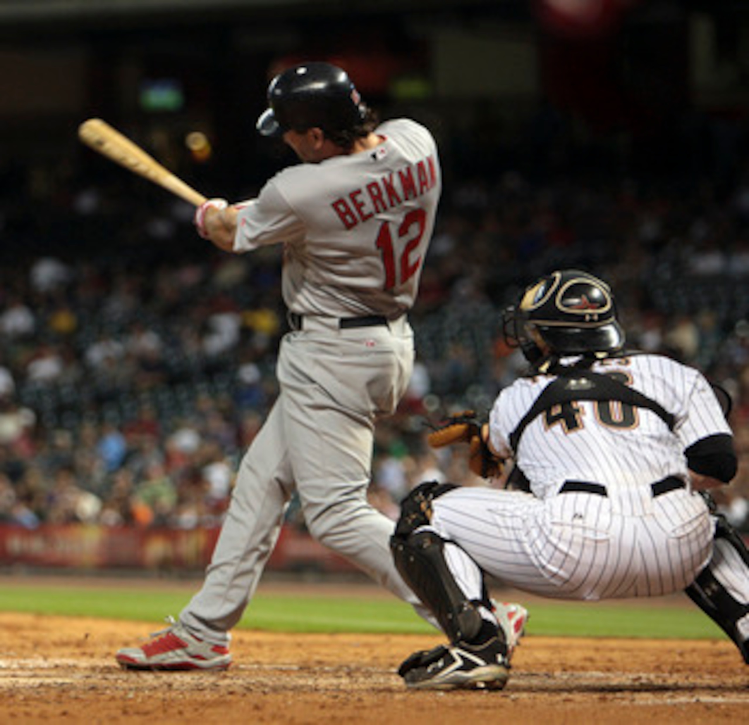 HOUSTON - JUNE 09:  Lance Berkman #12 of the St. Louis Cardinals hits a home run in the ninth inning against the Houston Astros at Minute Maid Park on June 9, 2011 in Houston, Texas.  (Photo by Bob Levey/Getty Images)
