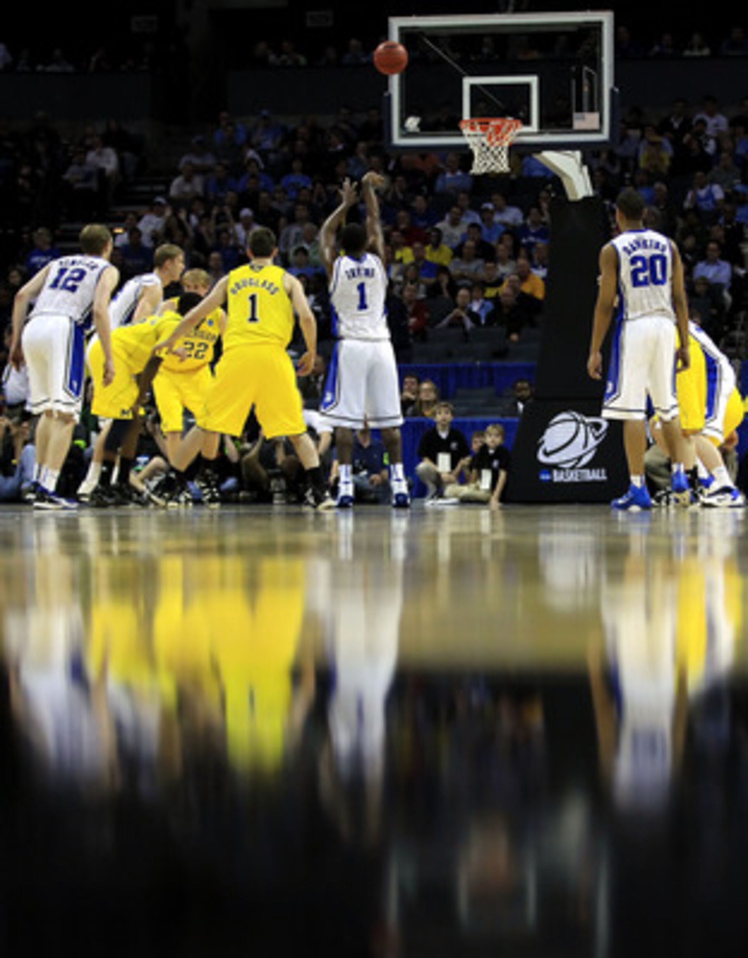CHARLOTTE, NC - MARCH 20:  Kyrie Irving #1 of the Duke Blue Devils shoots a free throw while taking on the Michigan Wolverines during the third round of the 2011 NCAA men's basketball tournament at Time Warner Cable Arena on March 20, 2011 in Charlotte, N