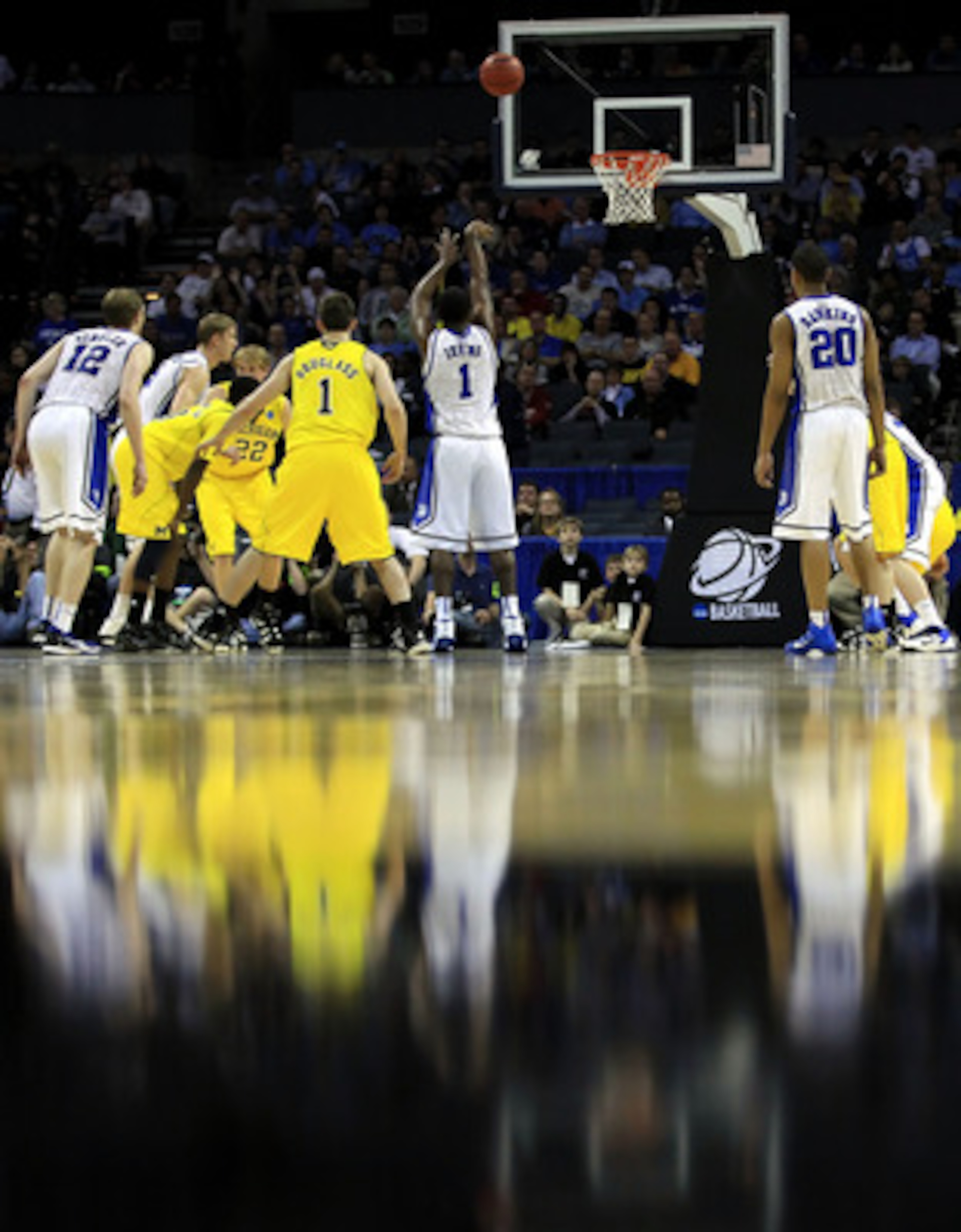CHARLOTTE, NC - MARCH 20:  Kyrie Irving #1 of the Duke Blue Devils shoots a free throw while taking on the Michigan Wolverines during the third round of the 2011 NCAA men's basketball tournament at Time Warner Cable Arena on March 20, 2011 in Charlotte, N