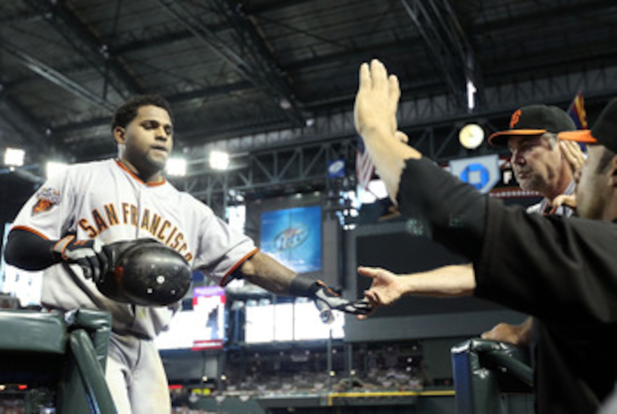 PHOENIX, AZ - APRIL 17:  Pablo Sandoval #48 of the San Francisco Giants high fives manager Bruce Bochy after Sandoval hit a solo home run against the Arizona Diamondbacks during the sixth inning of the Major League Baseball game at Chase Field on April 17