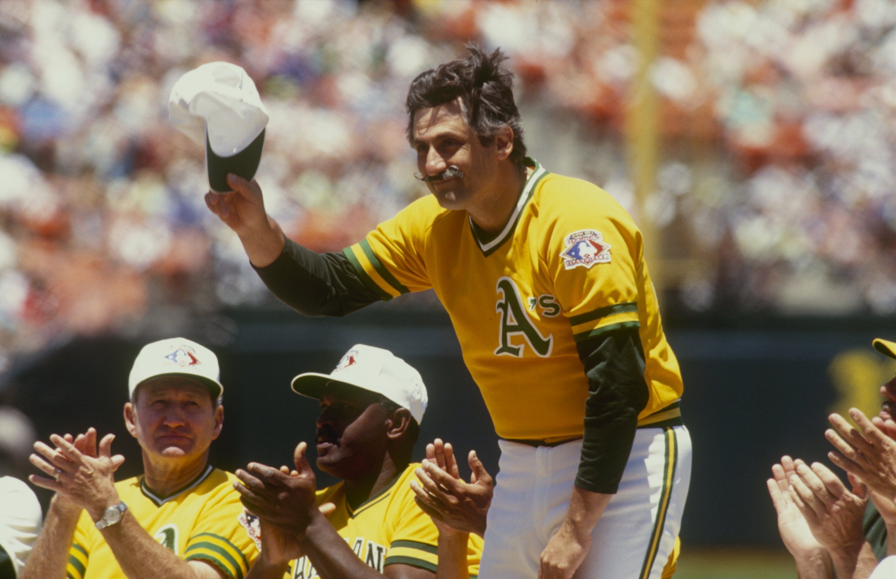 OAKLAND,CA - 1991: Retired pitcher Rollie Fingers of the Oakland Athletics waves after being introduced before the Old Timers game in the 1991 season at Oakland-Alameda County Coliseum  in Oakland,California. (Photo by: Otto Greule Jr/Getty Images)