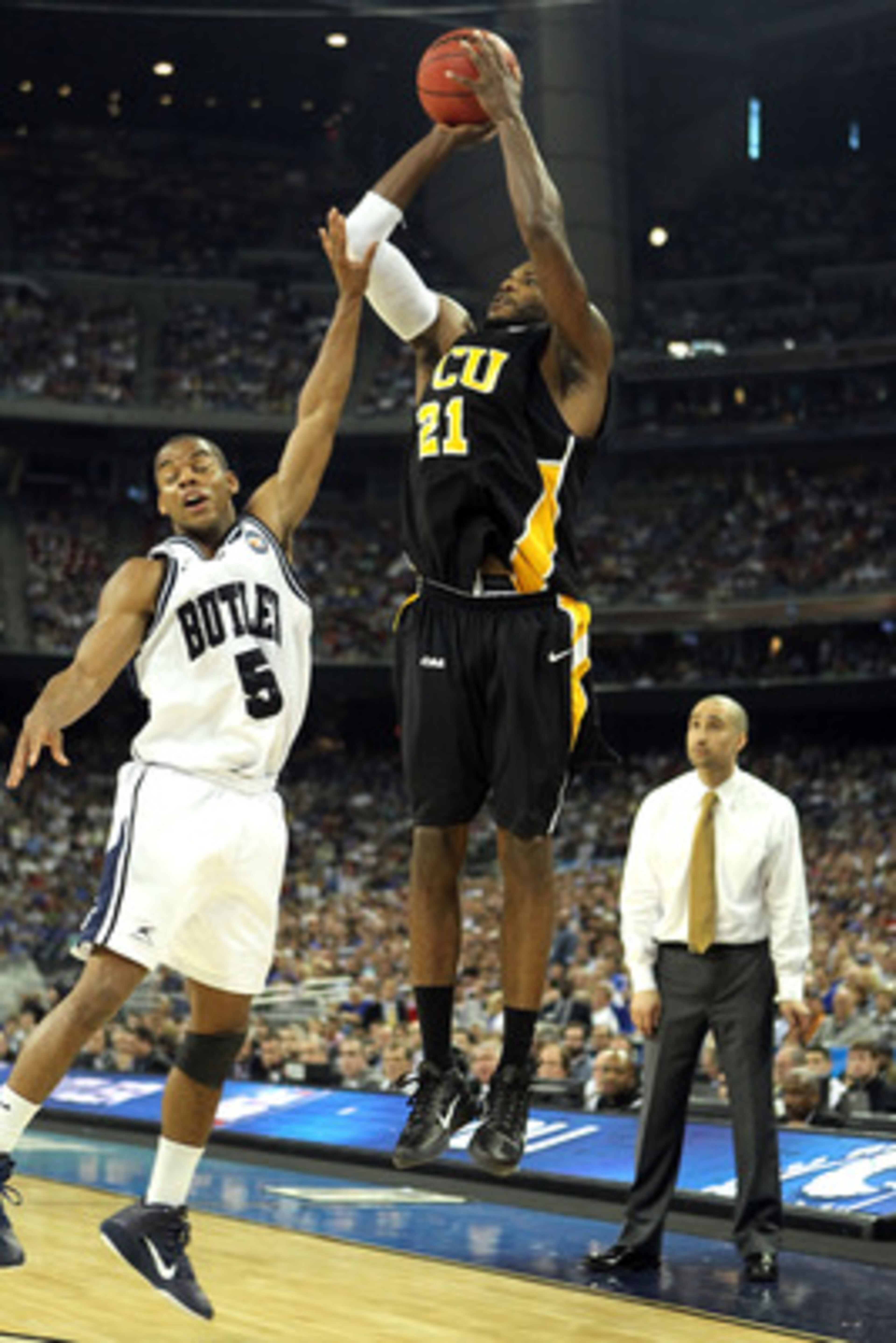 HOUSTON, TX - APRIL 02:  Jamie Skeen #21 of the Virginia Commonwealth Rams shoots the ball over Ronald Nored #5 of the Butler Bulldogs during the National Semifinal game of the 2011 NCAA Division I Men's Basketball Championship at Reliant Stadium on April
