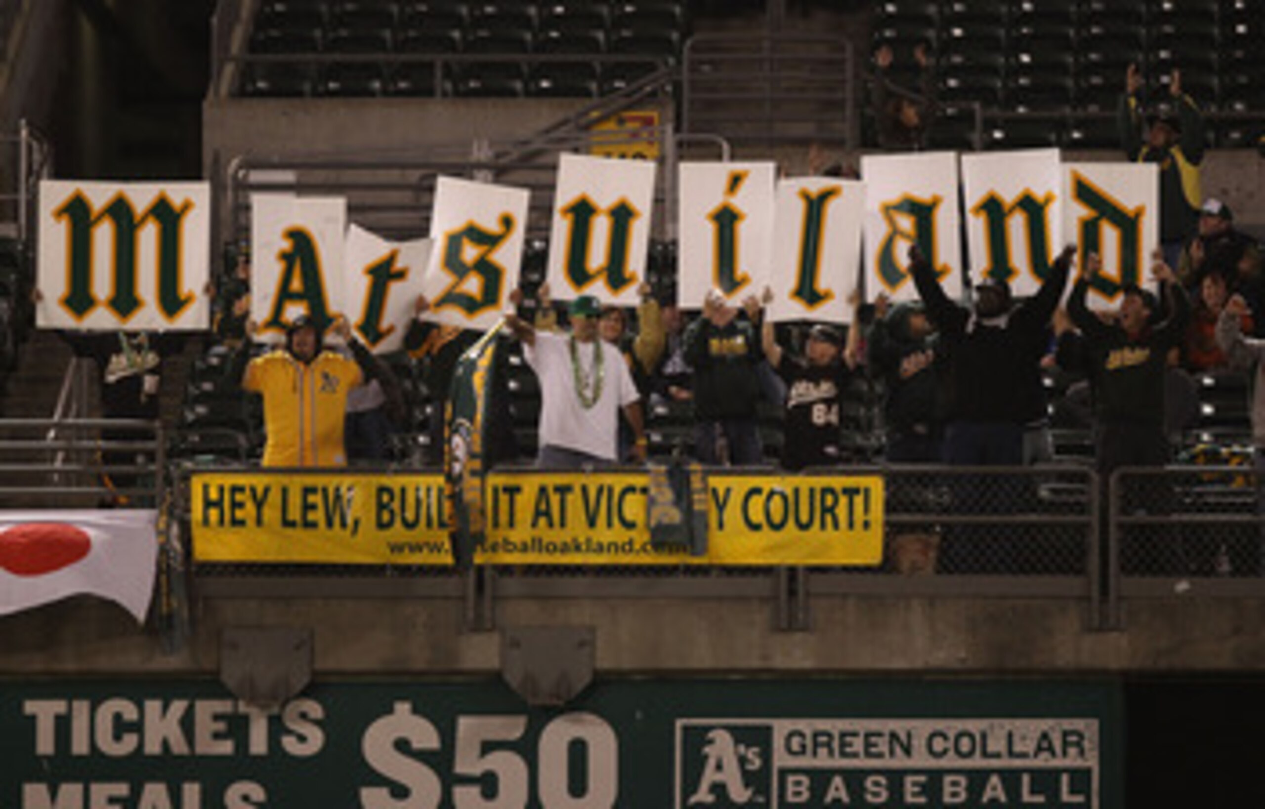 OAKLAND, CA - MAY 27:  Hideki Matsui fans of the Oakland Athletics cheer against the Baltimore Orioles during a Major League Baseball game at the Oakland-Alameda County Coliseum on May 27, 2011 in Oakland, California.  (Photo by Jed Jacobsohn/Getty Images