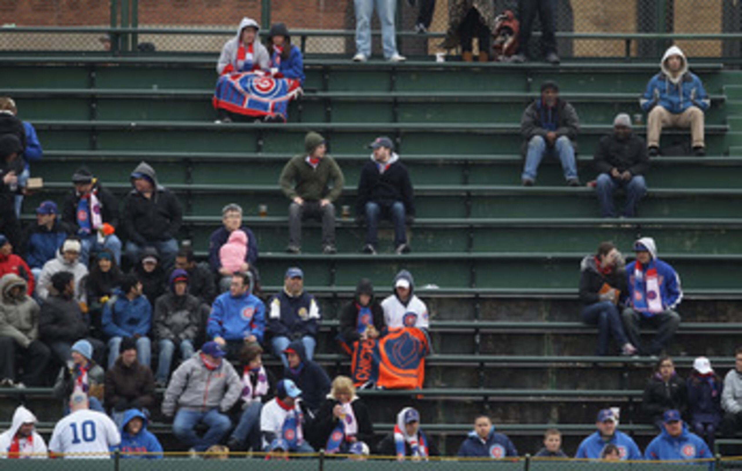 CHICAGO, IL - APRIL 20: Fans of the Chicago Cubs watch from the right field bleachers as the Cubs take on the San Diego Padres at Wrigley Field on April 20, 2011 in Chicago, Illinois. The Cubs defeated the Padres 2-1 in 11 innings. (Photo by Jonathan Dani