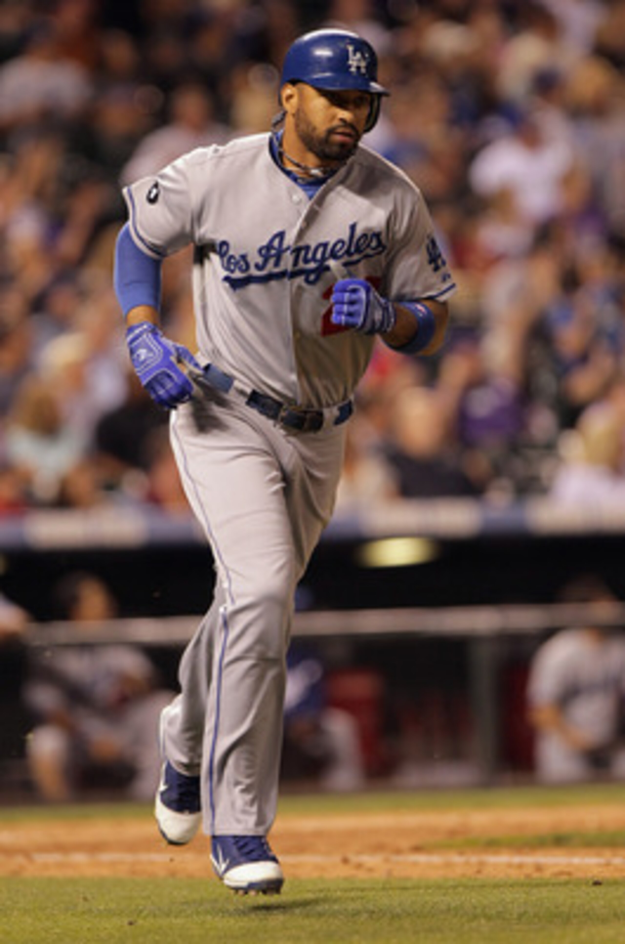 DENVER, CO - JUNE 10:  Matt Kemp #27 of the Los Angeles Dodgers rounds the bases as he hit a solo homerun off of Matt Belisle #34 of the Colorado Rockies in the ninth inning at Coors Field on June 10, 2011 in Denver, Colorado. The Rockies defeated the Dod