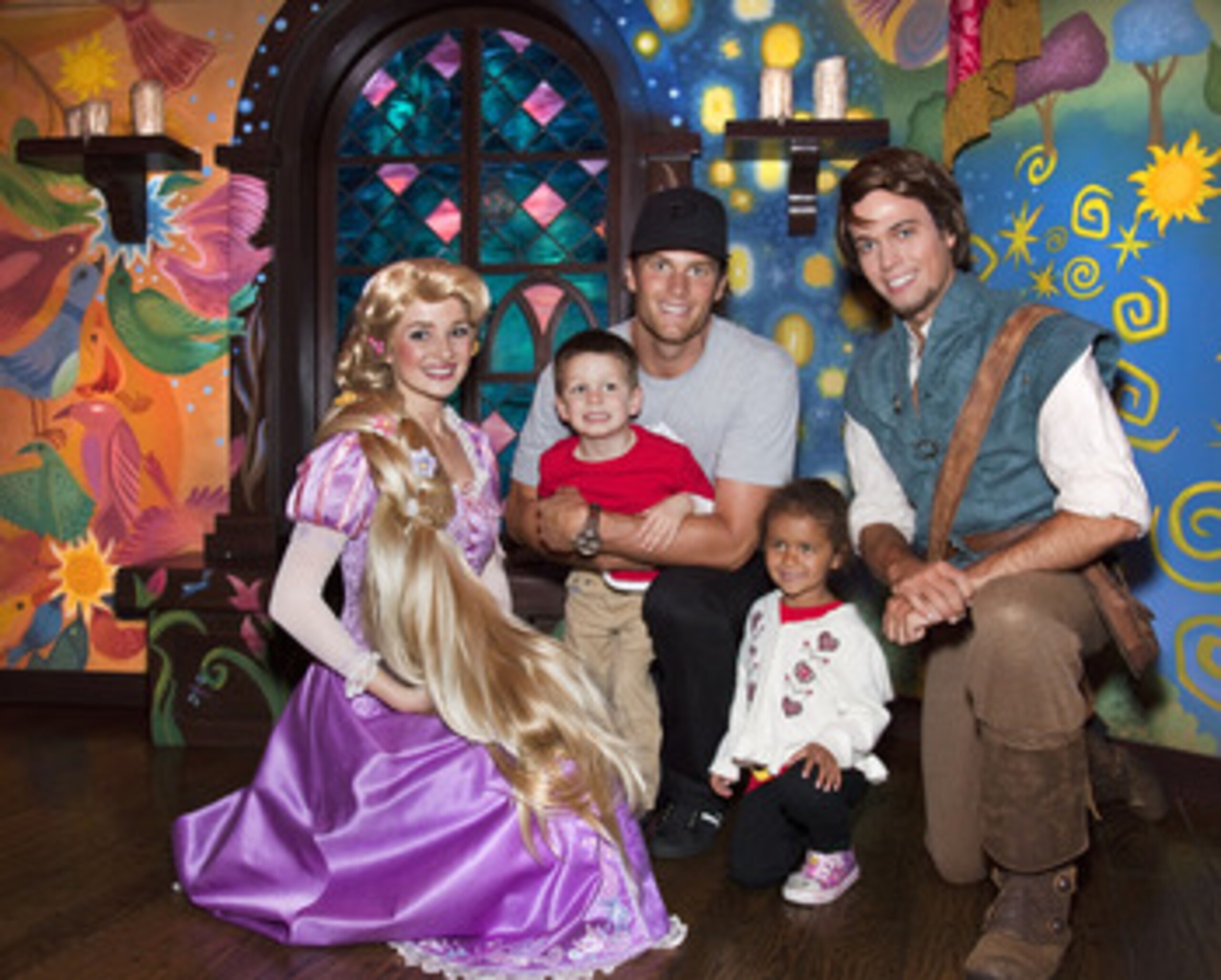 ANAHEIM, CA - APRIL 21:  In this handout photo provided by Disney Parks, New England Patriots Quarterback Tom Brady, his son Jack (4) and niece Jordan (5), meet Rapunzel and Flynn Rider of Disney's animated film, 'Tangled,' while celebrating Jordan's fift
