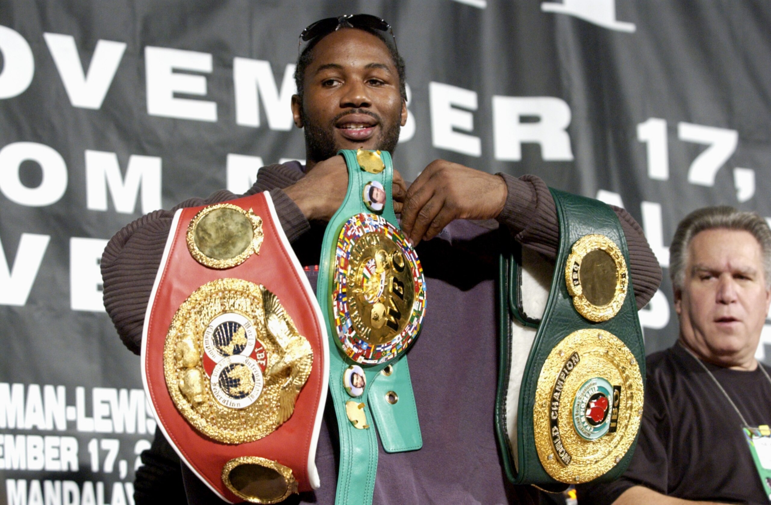 17 Nov 2001: Lennox Lewis shows off his belts  during a post fight press conference of the WBC/IBF World Heavyweight Championship fight against Hasim Rahman at  the Mandalay Bay Resort and Casino in Las Vegas, Nevada.   Lewis won with a fourth round knock