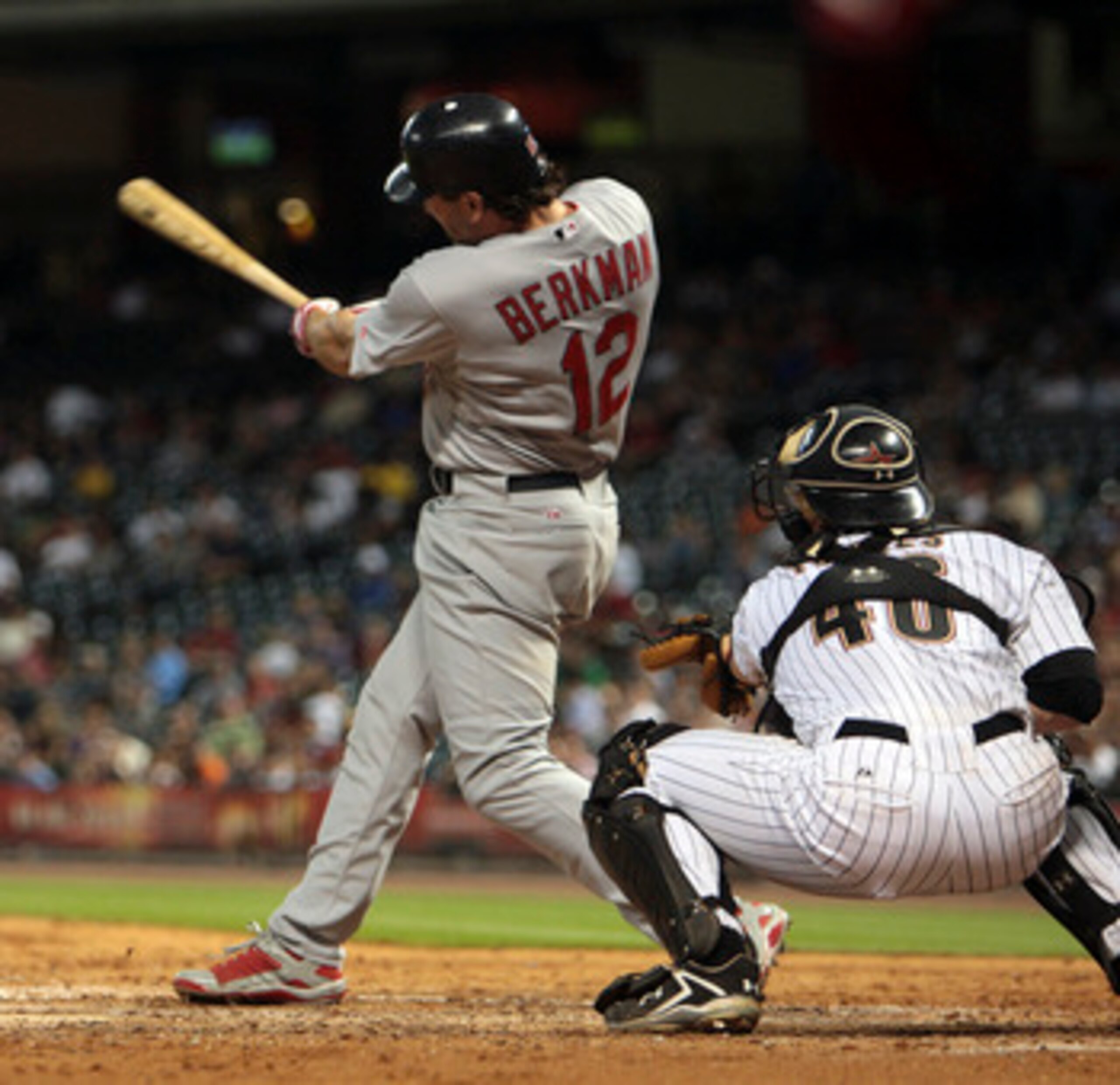 HOUSTON - JUNE 09:  Lance Berkman #12 of the St. Louis Cardinals hits a home run in the ninth inning against the Houston Astros at Minute Maid Park on June 9, 2011 in Houston, Texas.  (Photo by Bob Levey/Getty Images)