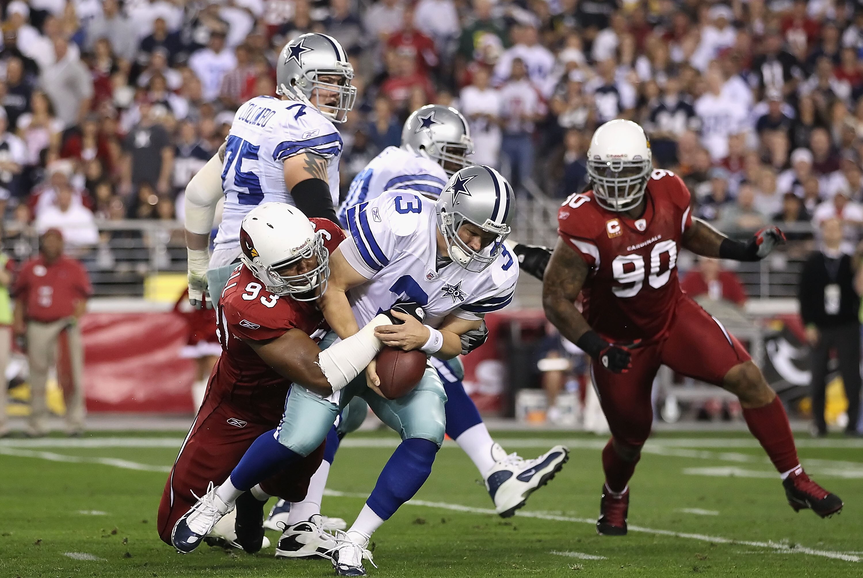 GLENDALE, AZ - DECEMBER 25:  Quarterback Jon Kitna #3 of the Dallas Cowboys is sacked during the NFL game against the Arizona Cardinals at the University of Phoenix Stadium on December 25, 2010 in Glendale, Arizona.  The Cardinals defeated the Cowboys 27-