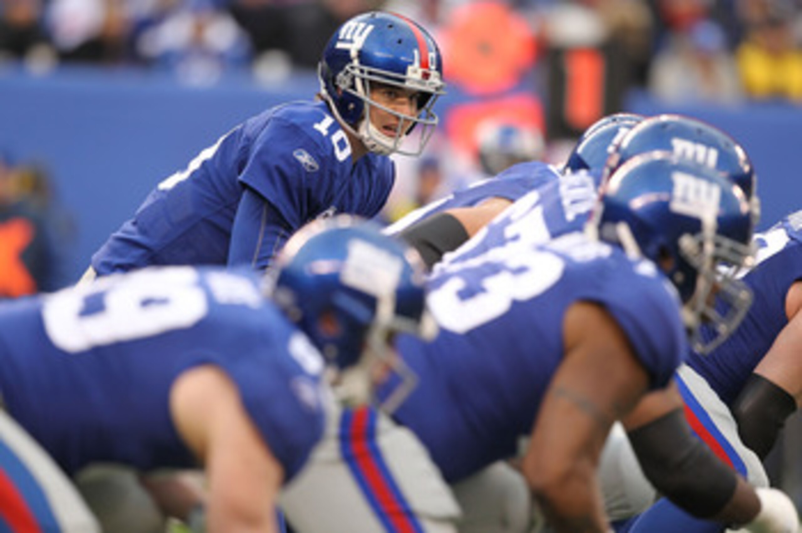 EAST RUTHERFORD, NJ - DECEMBER 19: Eli Manning #10 of the New York Giants gets ready for the snap during a game against  the Philadelphia Eagles on December 19, 2010 at The New Meadowlands Stadium in East Rutherford, New Jersey.  (Photo by Al Bello/Getty