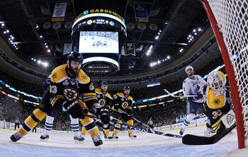 BOSTON, MA - JUNE 13:  Zdeno Chara #33 and Tim Thomas #30 of the Boston Bruins defends the net against the Vancouver Canucks during Game Six of the 2011 NHL Stanley Cup Final at TD Garden on June 13, 2011 in Boston, Massachusetts.  (Photo by Elsa/Getty Im