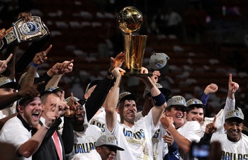 MIAMI, FL - JUNE 12:  Jason Kidd #2 of the Dallas Mavericks holds the Larry O'Brien trophy after the Mavericks won 105-95 against the Miami Heat in Game Six of the 2011 NBA Finals at American Airlines Arena on June 12, 2011 in Miami, Florida. NOTE TO USER