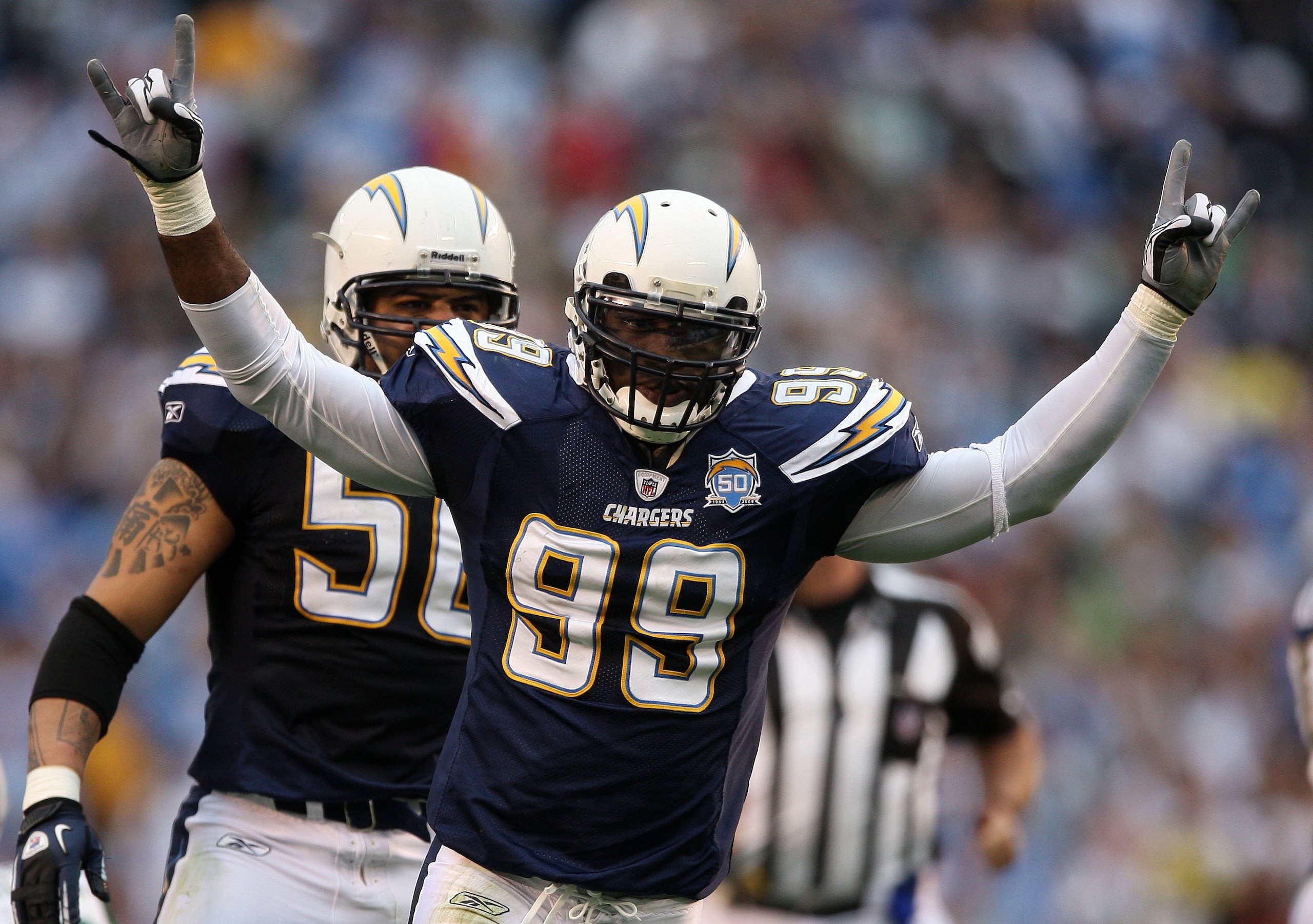 SAN DIEGO - JANUARY 17:  Linebacker Kevin Burnett #99 of the San Diego Chargers celebrates a play against the New York Jets during the AFC Divisional Playoff Game at Qualcomm Stadium on January 17, 2010 in San Diego, California.  (Photo by Donald Miralle/