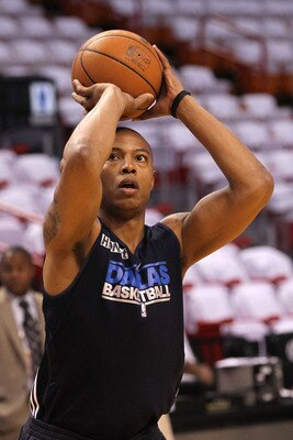 MIAMI, FL - MAY 31:  Caron Butler #4 of the Dallas Mavericks shoots before Game One of the 2011 NBA Finals against the Miami Heat at American Airlines Arena on May 31, 2011 in Miami, Florida. Butler is on the inactive roster. NOTE TO USER: User expressly