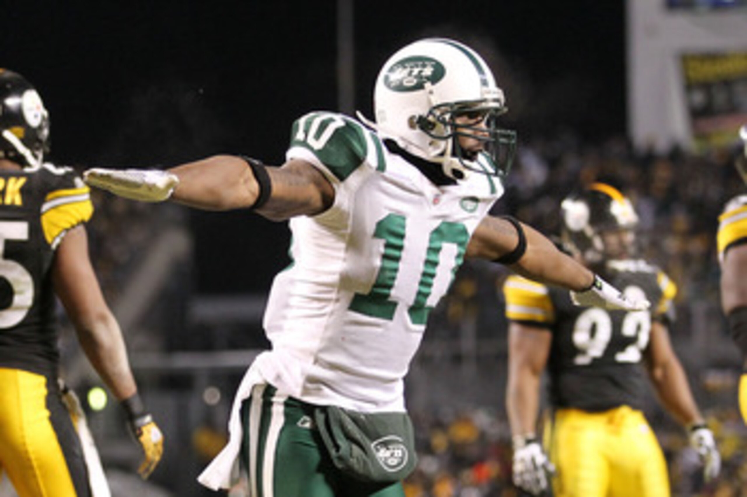 PITTSBURGH, PA - JANUARY 23: Santonio Holmes #10 of the New York Jets celebrates during their 19 to 24 loss to the Pittsburgh Steelers in the 2011 AFC Championship game at Heinz Field on January 23, 2011 in Pittsburgh, Pennsylvania. (Photo by Ronald Mar PITTSBURGH, PA - JANUARY 23: Santonio Holmes #10 of the New York Jets celebrates during their 19 to 24 loss to the Pittsburgh Steelers in the 2011 AFC Championship game at Heinz Field on January 23, 2011 in Pittsburgh, Pennsylvania. (Photo by Ronald Mar