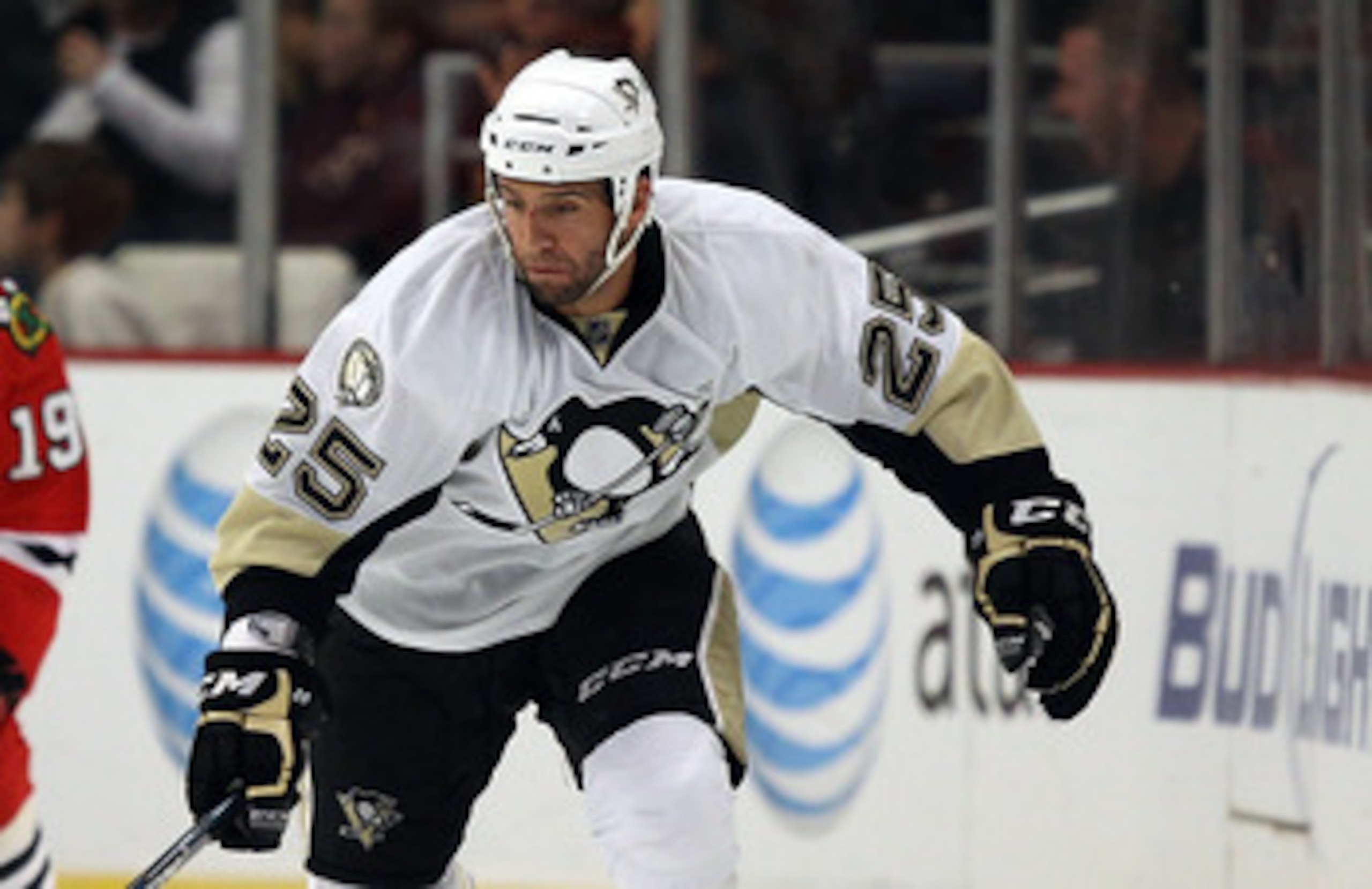 CHICAGO - OCTOBER 01: Max Talbot #25 of the Pittsburgh Penguins skates past Jonathan Toews #19 of the Chicago Blackhawks during a pre-season game at the United Center on October 1, 2010 in Chicago, Illinois. The Blackhawks defeated the Penguins 5-2.  (Pho