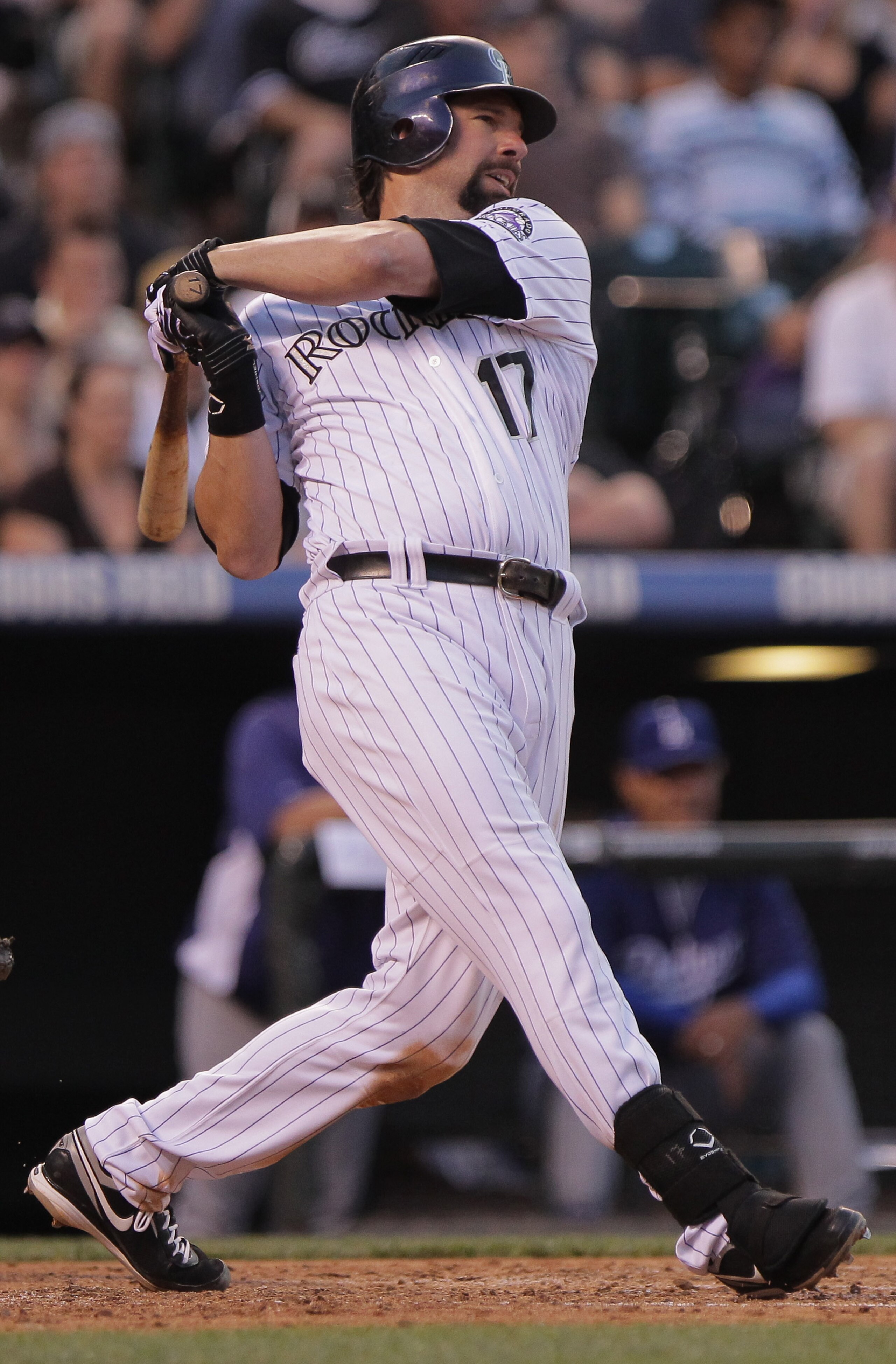 DENVER, CO - JUNE 10:  Todd Helton #17 of the Colorado Rockies hits a two RBI single off of starting pitcher Chad Billingsley of the Los Angeles Dodgers to give the Rockies a 3-0 lead in the fifth inning at Coors Field on June 10, 2011 in Denver, Colorado