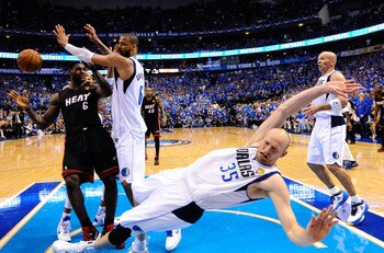 DALLAS, TX - JUNE 09: Brian Cardinal #35 of the Dallas Mavericks falls to the court while defending against LeBron James #6 of the Miami Heat  in Game Five of the 2011 NBA Finals at American Airlines Center on June 9, 2011 in Dallas, Texas.  NOTE TO USER: