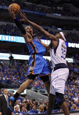 DALLAS, TX - MAY 25:  Russell Westbrook #0 of the Oklahoma City Thunder goes up for a shot against Brendan Haywood #33 of the Dallas Mavericks in the second half in Game Five of the Western Conference Finals during the 2011 NBA Playoffs at American Airlin