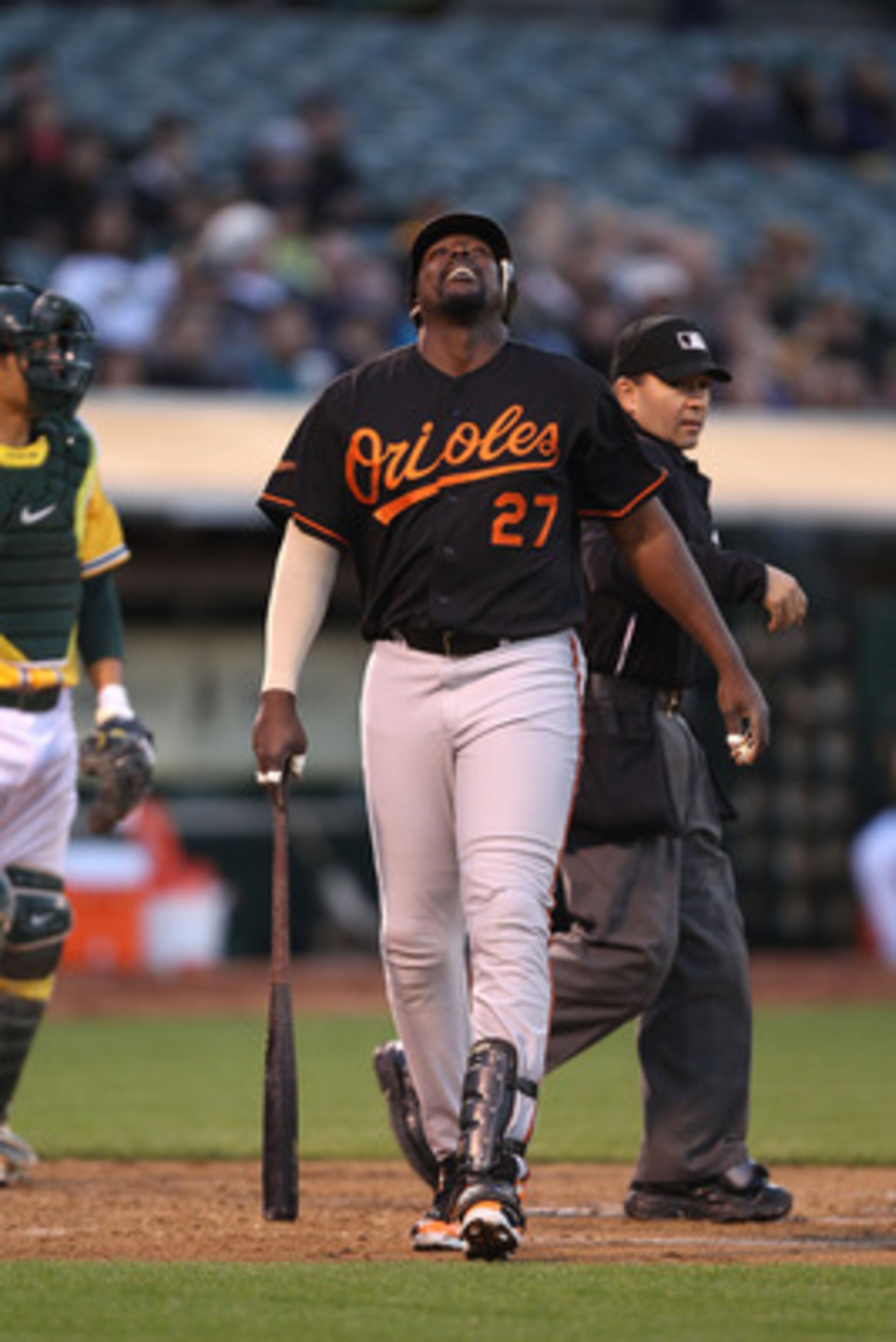 OAKLAND, CA - MAY 27:  Vladimir Guerrero #27 of the Baltimore Orioles reacts after being hit by a pitch against the Oakland Athletics during a Major League Baseball game at the Oakland-Alameda County Coliseum on May 27, 2011 in Oakland, California.  (Phot