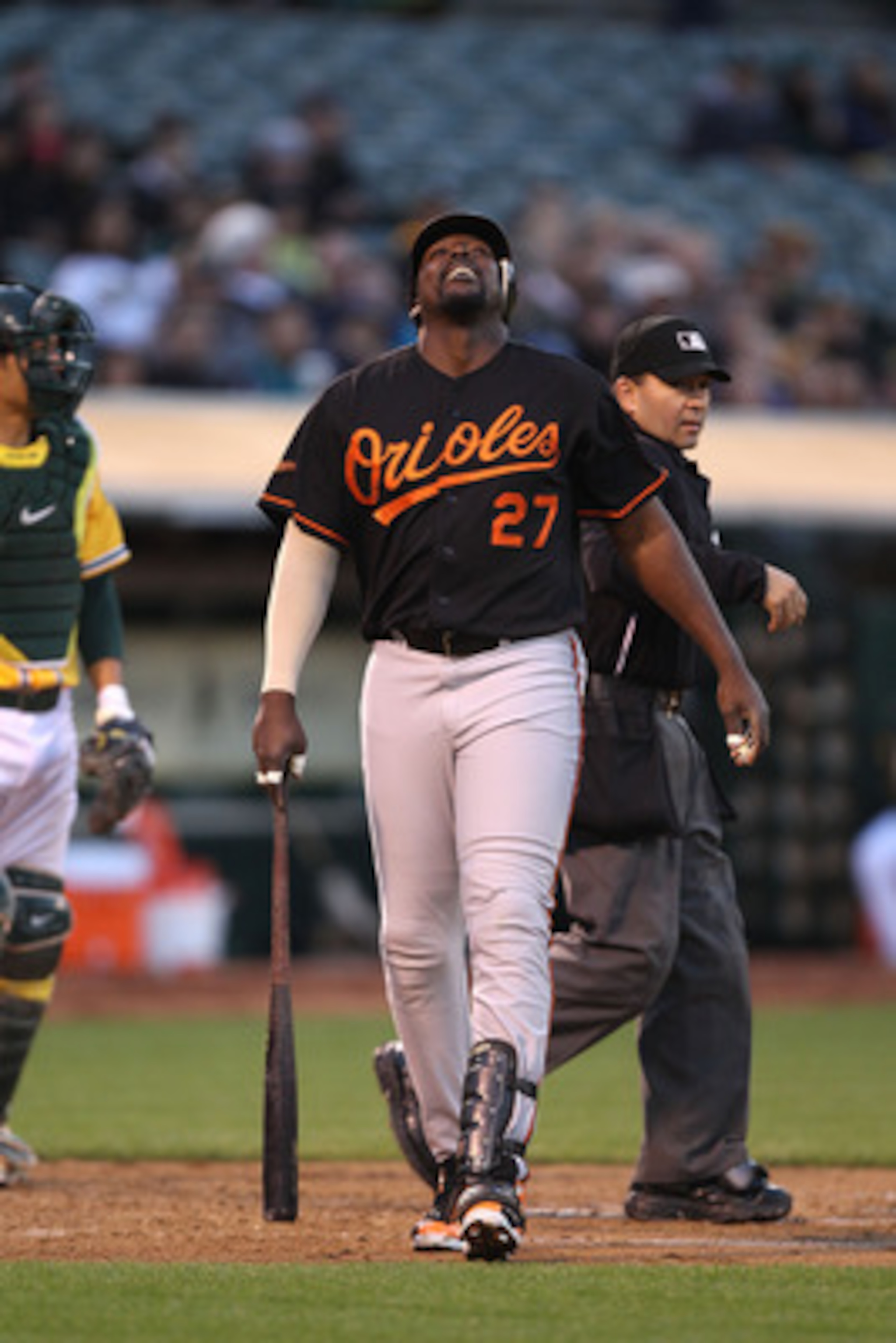 OAKLAND, CA - MAY 27:  Vladimir Guerrero #27 of the Baltimore Orioles reacts after being hit by a pitch against the Oakland Athletics during a Major League Baseball game at the Oakland-Alameda County Coliseum on May 27, 2011 in Oakland, California.  (Phot