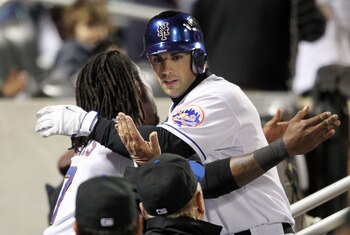 NEW YORK, NY - APRIL 21:  David Wright #5 of the New York Mets celebrates his fourth inning solo home run in the dugout with teammate Jose Reyes #7 against the Houston Astros at Citi Field on April 21, 2011 in the Flushing neighborhood of the Queens borou