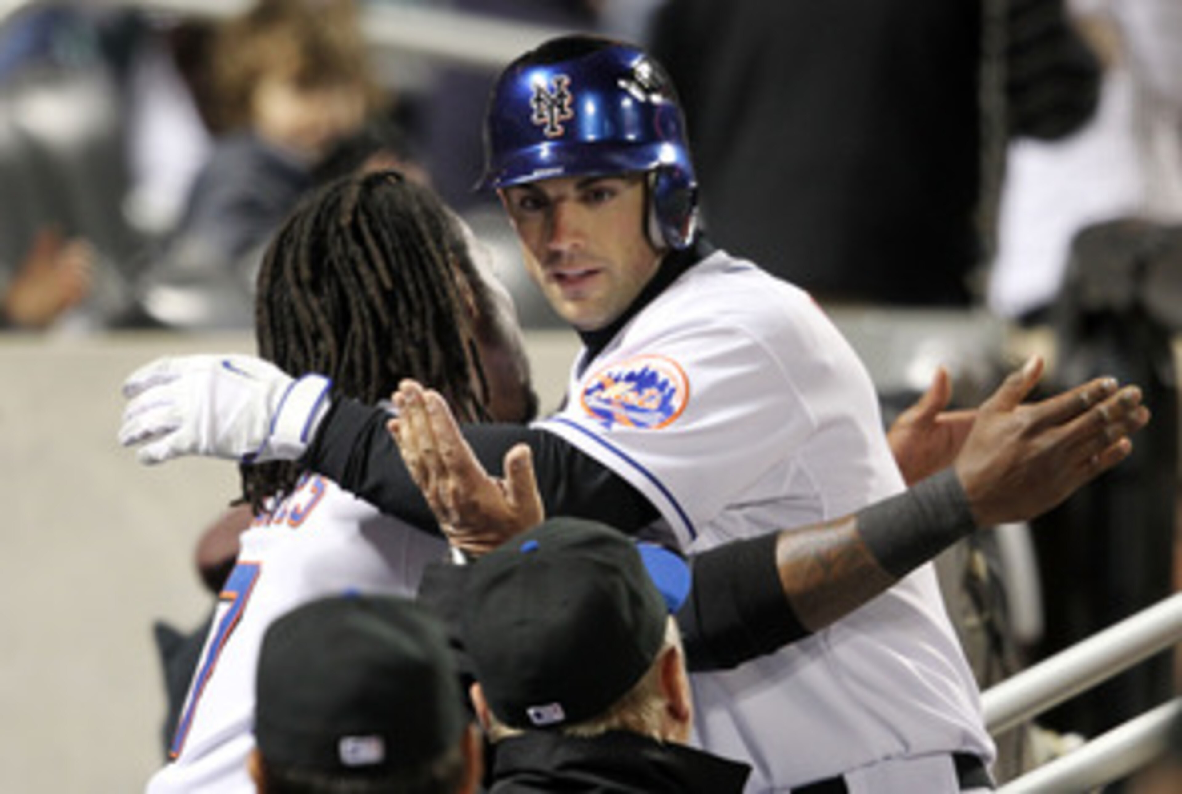 NEW YORK, NY - APRIL 21:  David Wright #5 of the New York Mets celebrates his fourth inning solo home run in the dugout with teammate Jose Reyes #7 against the Houston Astros at Citi Field on April 21, 2011 in the Flushing neighborhood of the Queens borou
