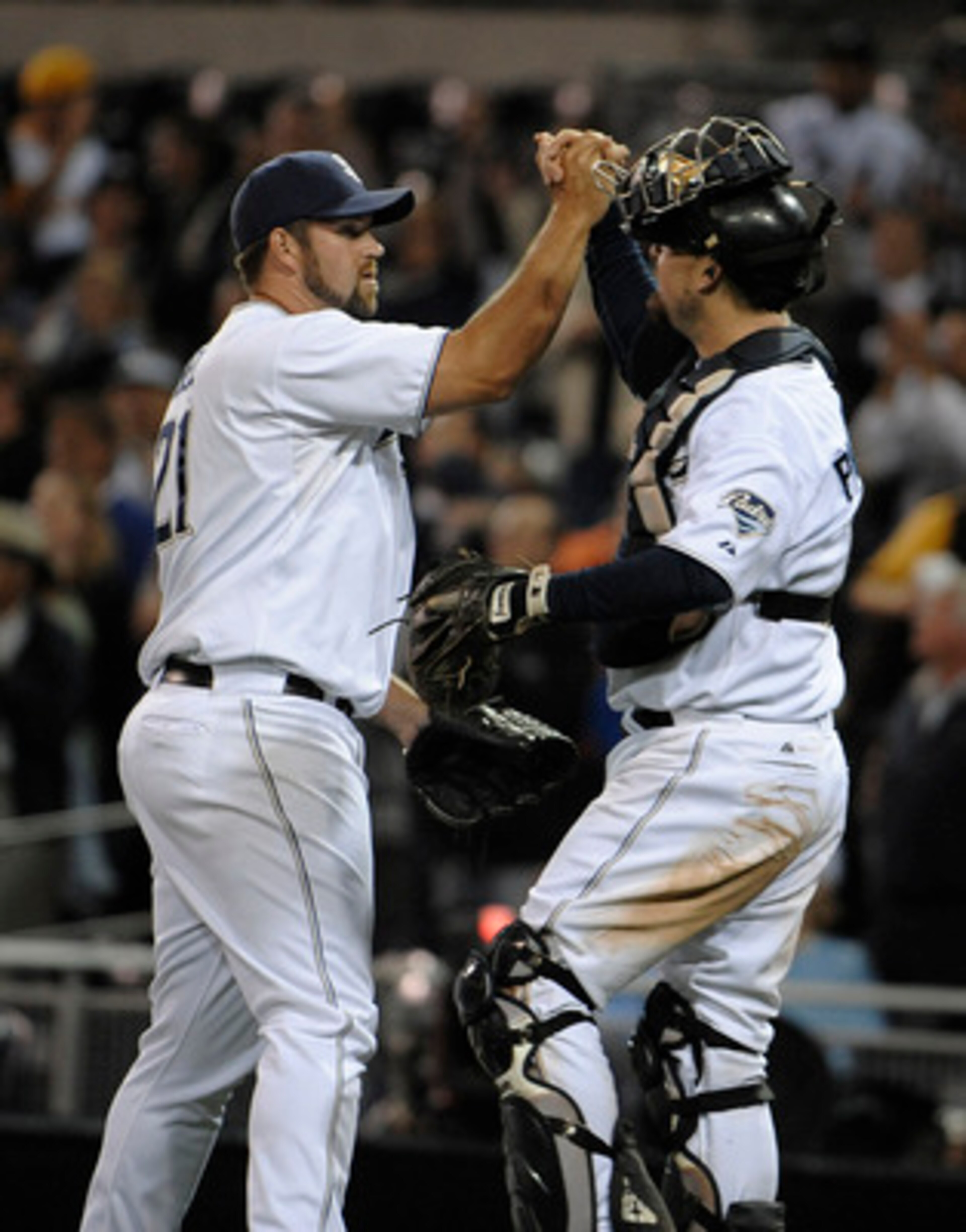 SAN DIEGO, CA - JUNE 7: (L-R) Heath Bell #21 of the San Diego Padres, is congratulated by catcher Kyle Phillips after getting the final out in the ninth inning of a baseball game against the Colorado Rockies at Petco Park on June 7, 2011 in San Diego, Cal