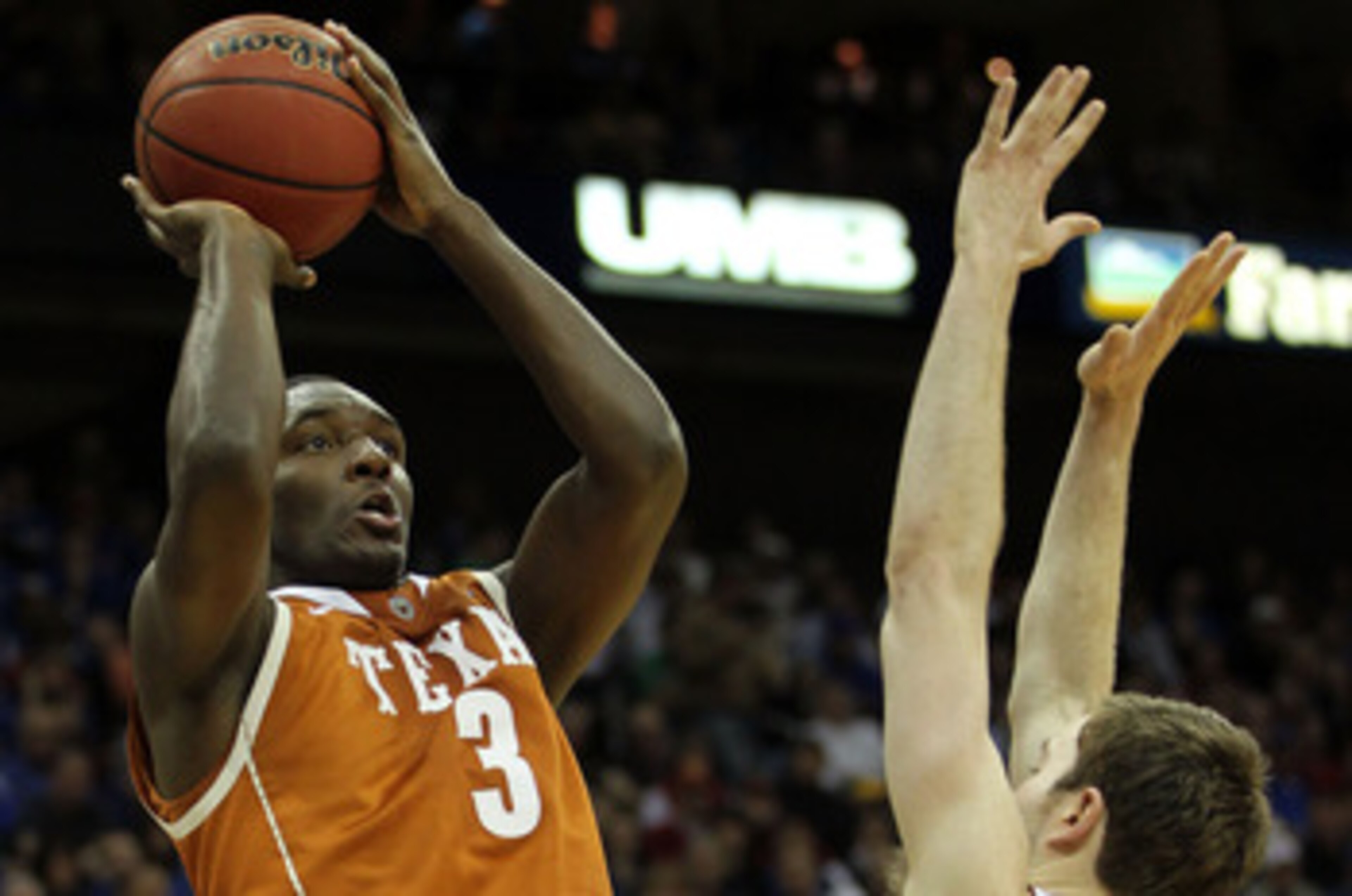 KANSAS CITY, MO - MARCH 12:  Jordan Hamilton #3 of the Texas Longhorns goes up for a shot against Brady Morningstar #12 of the Kansas Jayhawks during the 2011 Phillips 66 Big 12 Men's Basketball Tournament championship game at Sprint Center on March 12, 2