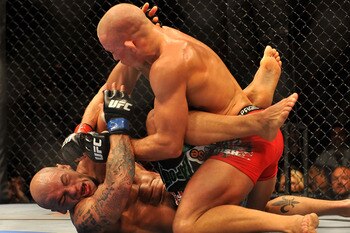 LAS VEGAS - JULY 11:  (Top) Georges St. Pierre battles Thiago Alves during their welterweight title bout during UFC 100 on July 11, 2009 in Las Vegas, Nevada.  (Photo by Jon Kopaloff/Getty Images)