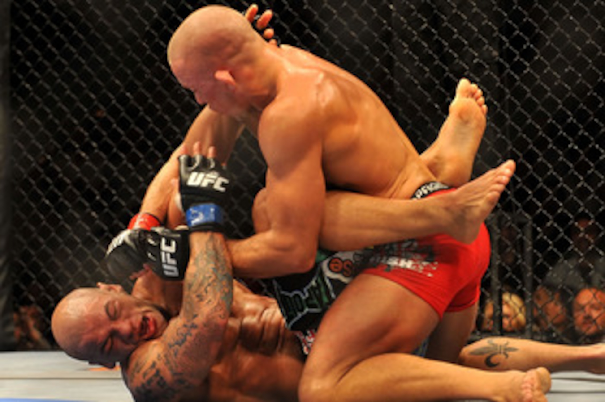 LAS VEGAS - JULY 11:  (Top) Georges St. Pierre battles Thiago Alves during their welterweight title bout during UFC 100 on July 11, 2009 in Las Vegas, Nevada.  (Photo by Jon Kopaloff/Getty Images)