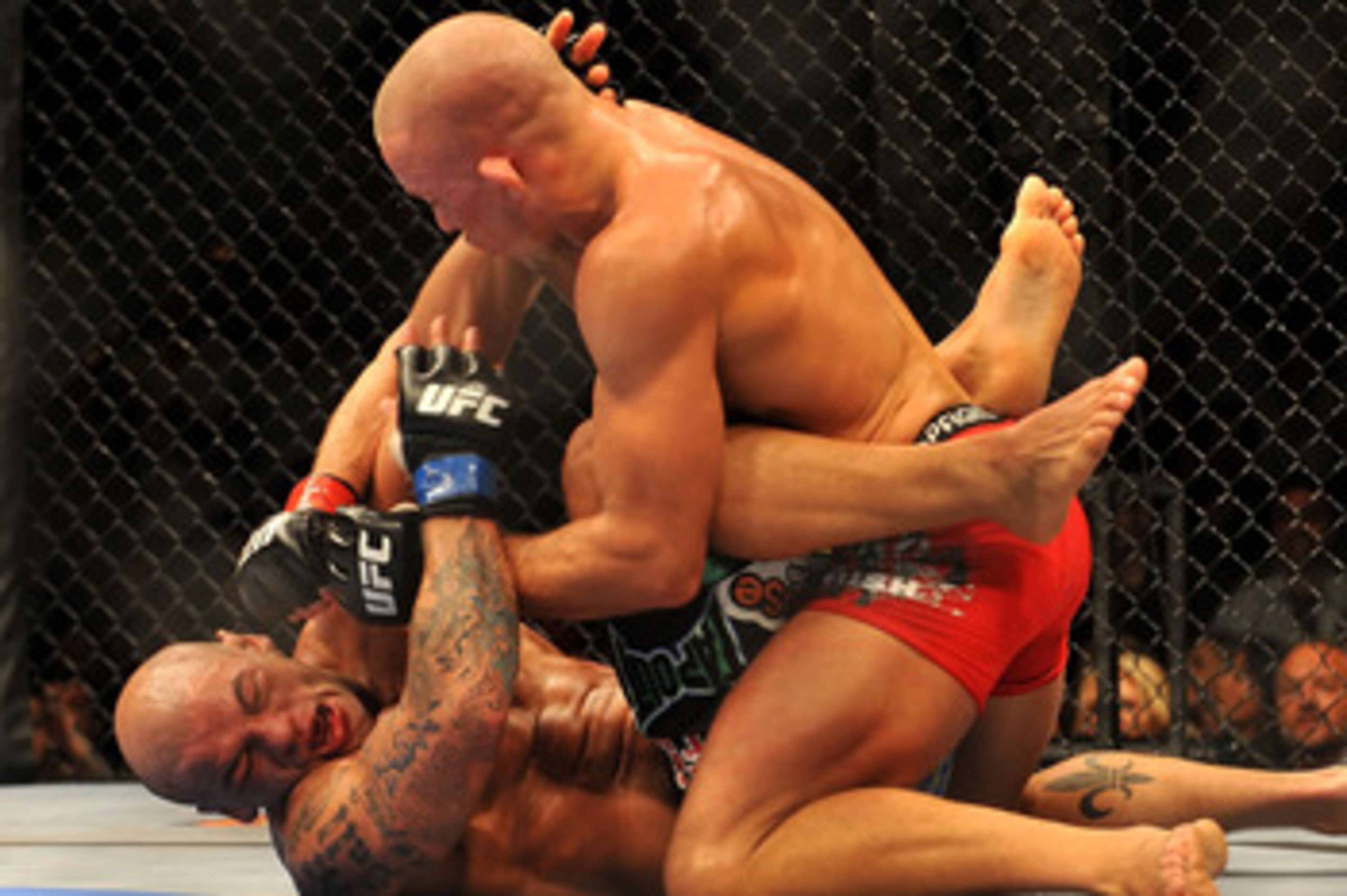 LAS VEGAS - JULY 11:  (Top) Georges St. Pierre battles Thiago Alves during their welterweight title bout during UFC 100 on July 11, 2009 in Las Vegas, Nevada.  (Photo by Jon Kopaloff/Getty Images)