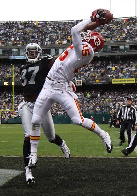 OAKLAND, CA - NOVEMBER 07:  Verran Tucker #15 of the Kansas City Chiefs catches a touchdown pass over Chirs Johnson #37 of the Oakland Raiders during an NFL game at Oakland-Alameda County Coliseum on November 7, 2010 in Oakland, California.  (Photo by Jed