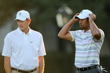 AUGUSTA, GA - APRIL 05:  Tiger Woods waits with swing coach Hank Haney on the practice range during a practice round prior to the 2010 Masters Tournament at Augusta National Golf Club on April 5, 2010 in Augusta, Georgia.  (Photo by Jamie Squire/Getty Ima