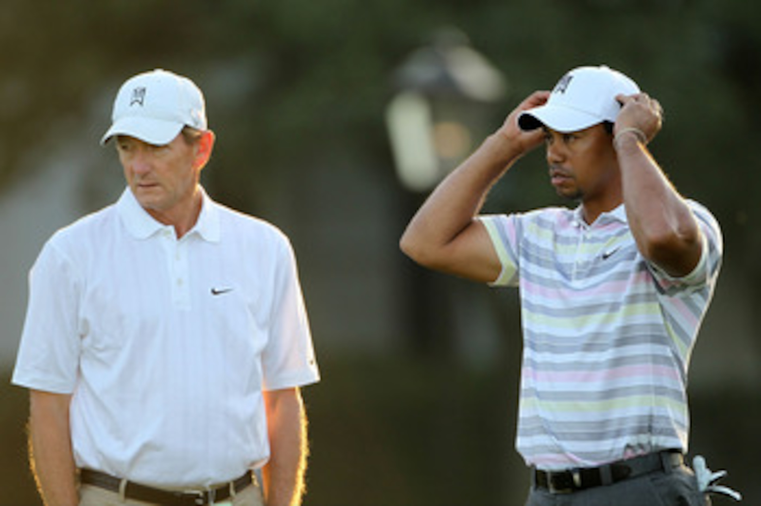 AUGUSTA, GA - APRIL 05:  Tiger Woods waits with swing coach Hank Haney on the practice range during a practice round prior to the 2010 Masters Tournament at Augusta National Golf Club on April 5, 2010 in Augusta, Georgia.  (Photo by Jamie Squire/Getty Ima