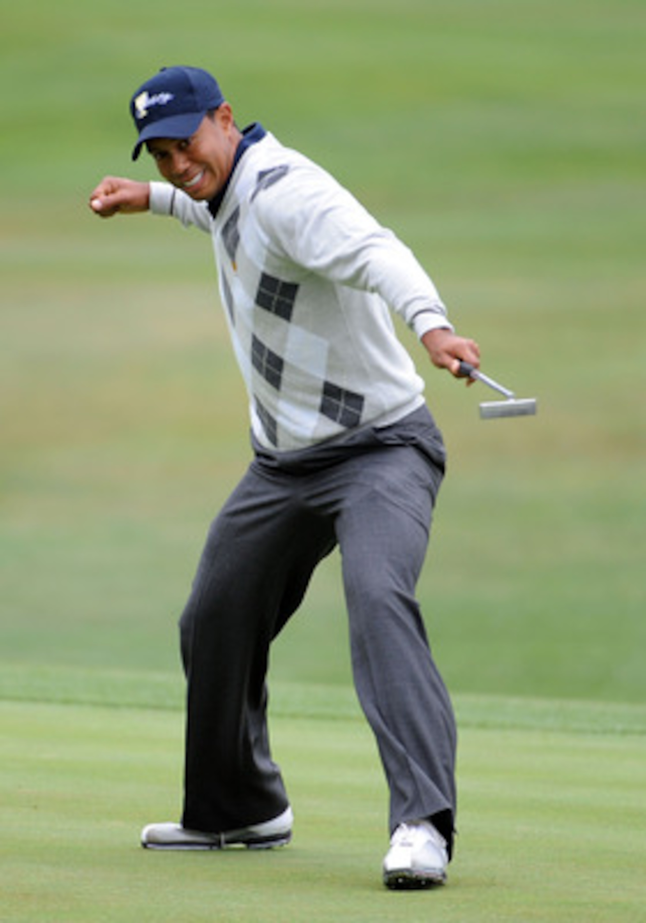 SAN FRANCISCO - OCTOBER 10:  Tiger Woods of the USA Team celebrates his putt for a birdie to win the 17th hole during the Day Three Morning Foursome Matches of The Presidents Cup at Harding Park Golf Course on October 10, 2009 in San Francisco, California