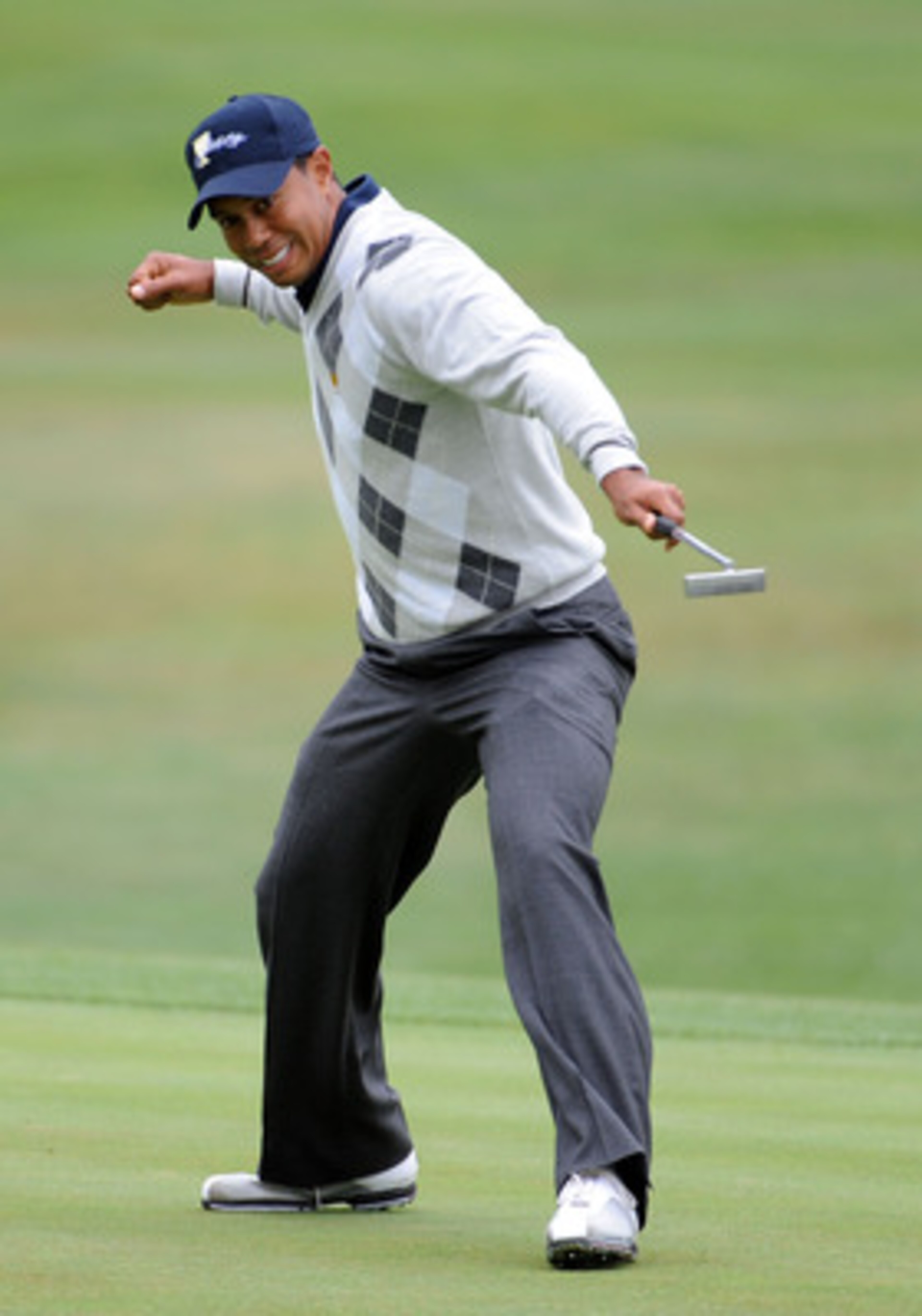 SAN FRANCISCO - OCTOBER 10:  Tiger Woods of the USA Team celebrates his putt for a birdie to win the 17th hole during the Day Three Morning Foursome Matches of The Presidents Cup at Harding Park Golf Course on October 10, 2009 in San Francisco, California