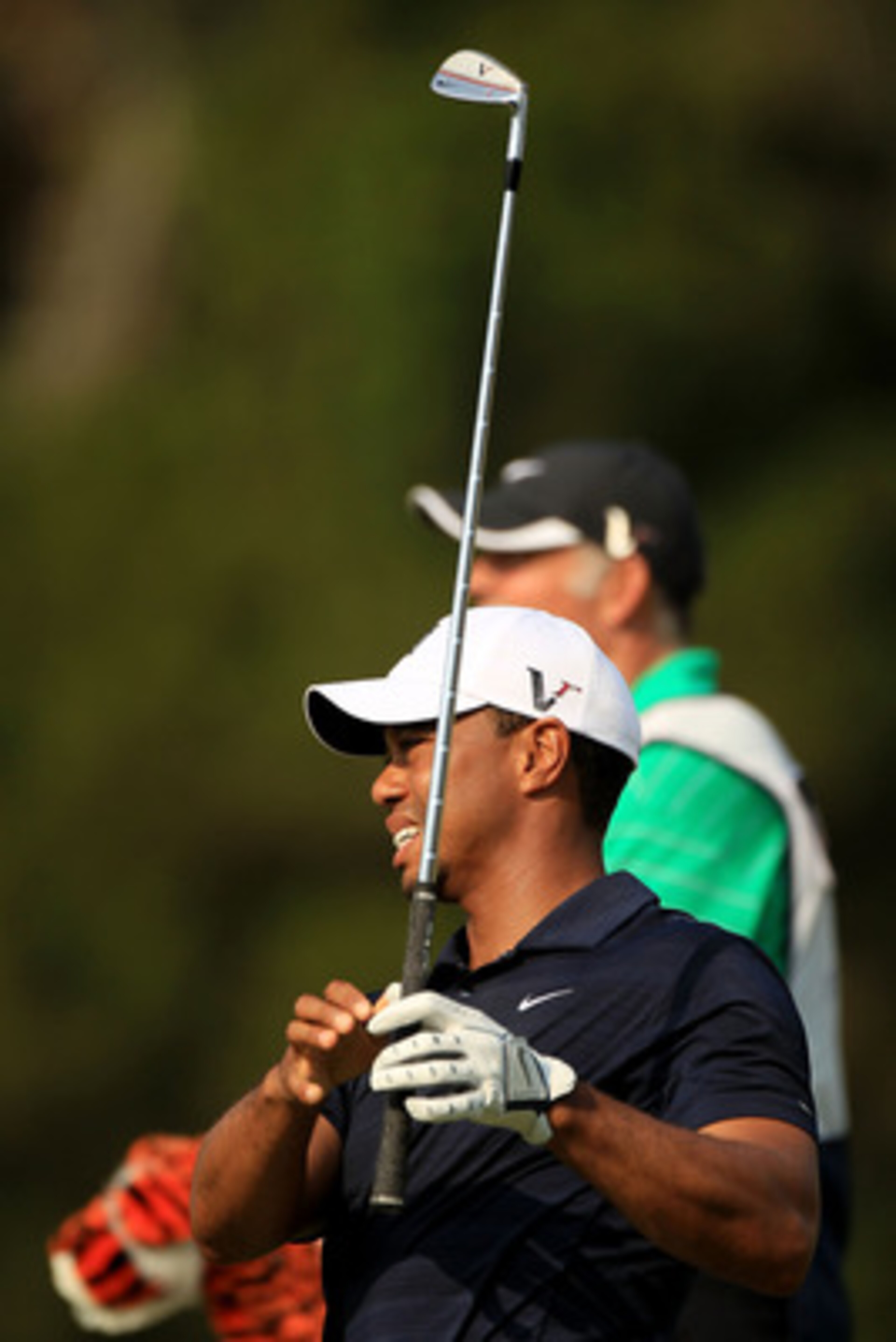PONTE VEDRA BEACH, FL - MAY 12:  Tiger Woods hits a shot on the fifth hole as caddie Steve Williams looks on during the first round of THE PLAYERS Championship held at THE PLAYERS Stadium course at TPC Sawgrass on May 12, 2011 in Ponte Vedra Beach, Florid