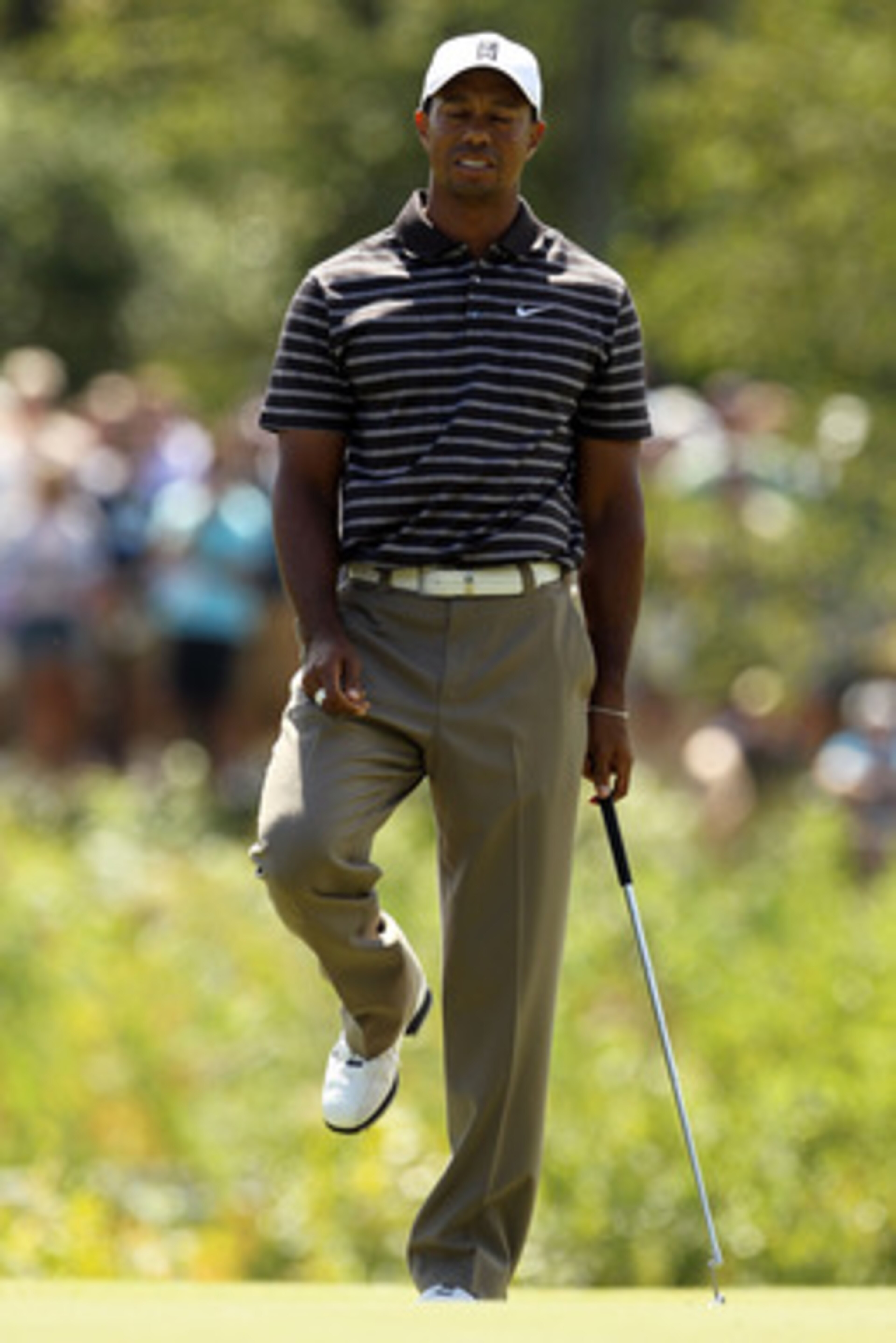 NORTON, MA - SEPTEMBER 05:  Tiger Woods reacts on the eighth green during the third round of the Deutsche Bank Championship at TPC Boston on September 5, 2010 in Norton, Massachusetts.  (Photo by Mike Ehrmann/Getty Images)