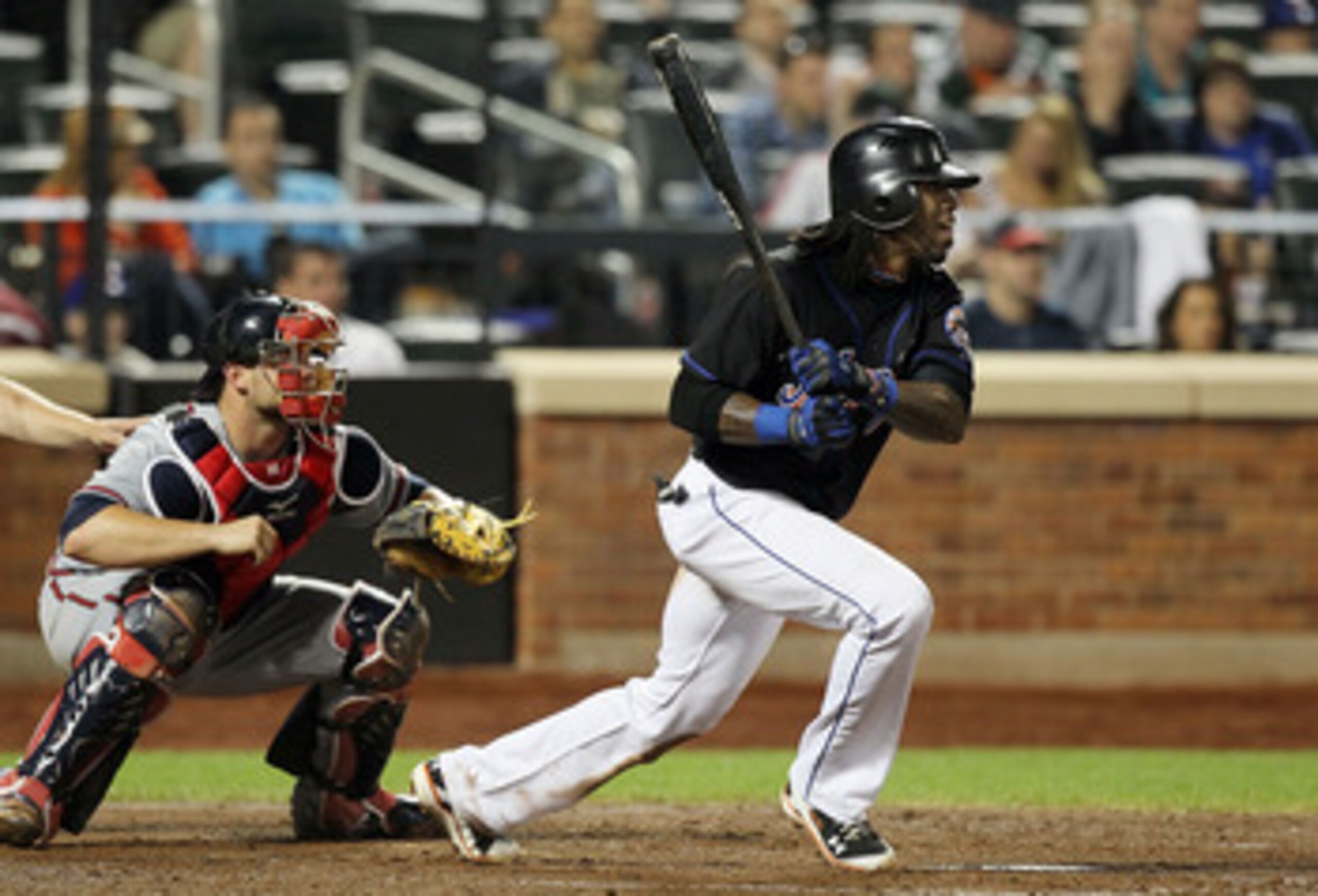 NEW YORK, NY - JUNE 05:  Jose Reyes #7 of the New York Mets follows through on his fourth inning RBI double against the Atlanta Braves on June 5, 2011 at Citi Field in the Flushing neighborhood of the Queens borough of New York City.  (Photo by Jim McIsaa