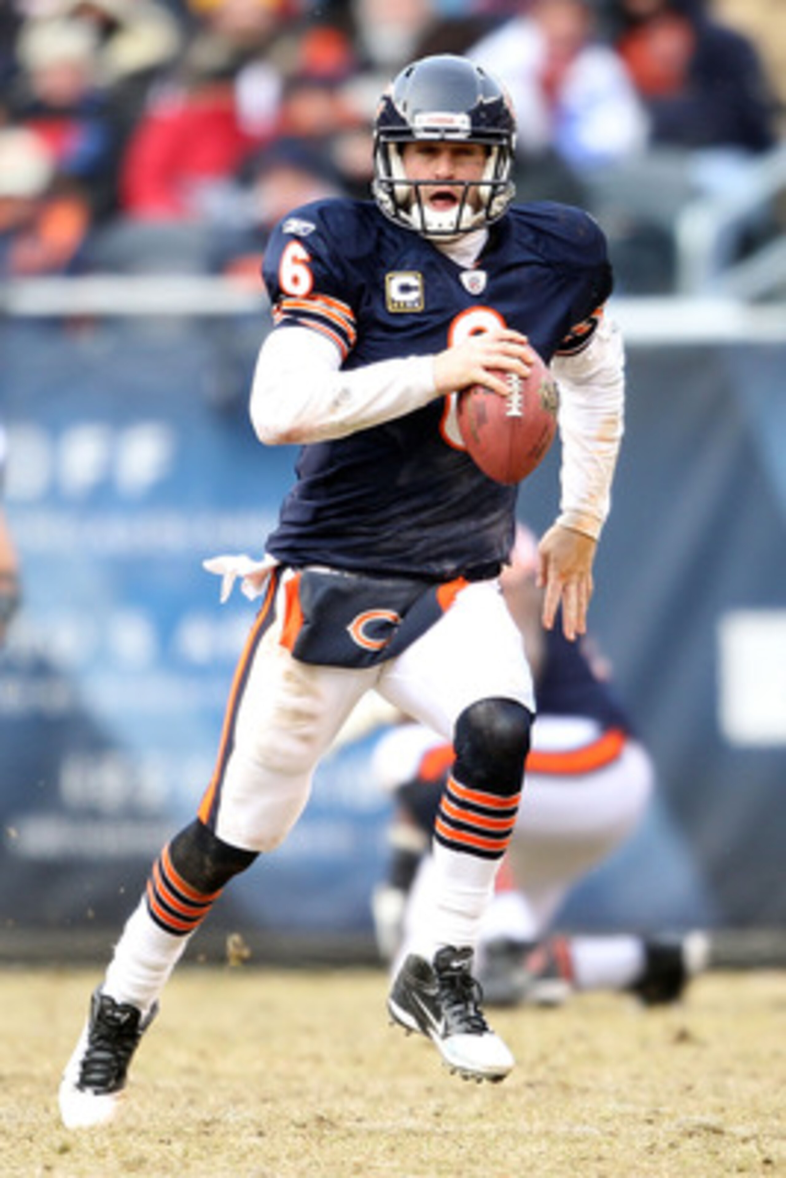 CHICAGO, IL - JANUARY 16:  Quarterback Jay Cutler #6 of the Chicago Bears runs the ball against the Seattle Seahawks in the second quarter of the 2011 NFC divisional playoff game at Soldier Field on January 16, 2011 in Chicago, Illinois.  (Photo by Andy L