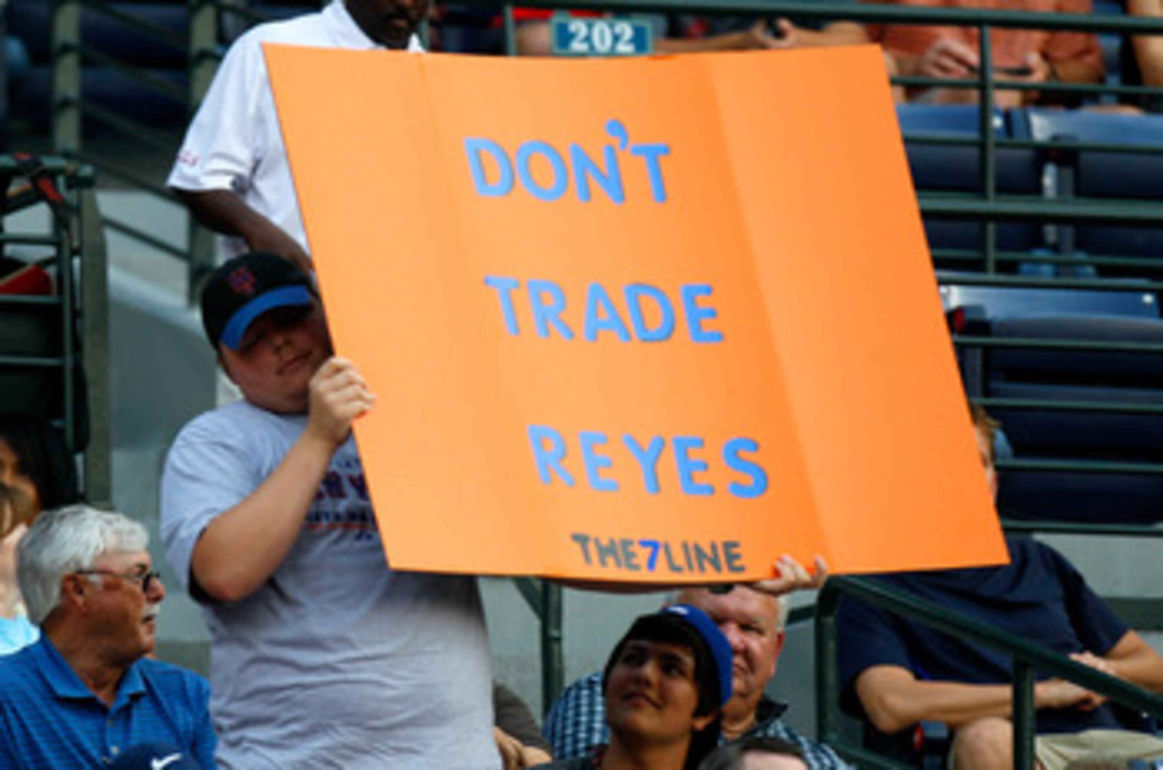 ATLANTA, GA - JUNE 14:  A young New York Mets fan holds up a sign with the words 'Don't Trade Reyes' during the game against the Atlanta Braves at Turner Field on June 14, 2011 in Atlanta, Georgia.  (Photo by Kevin C. Cox/Getty Images)