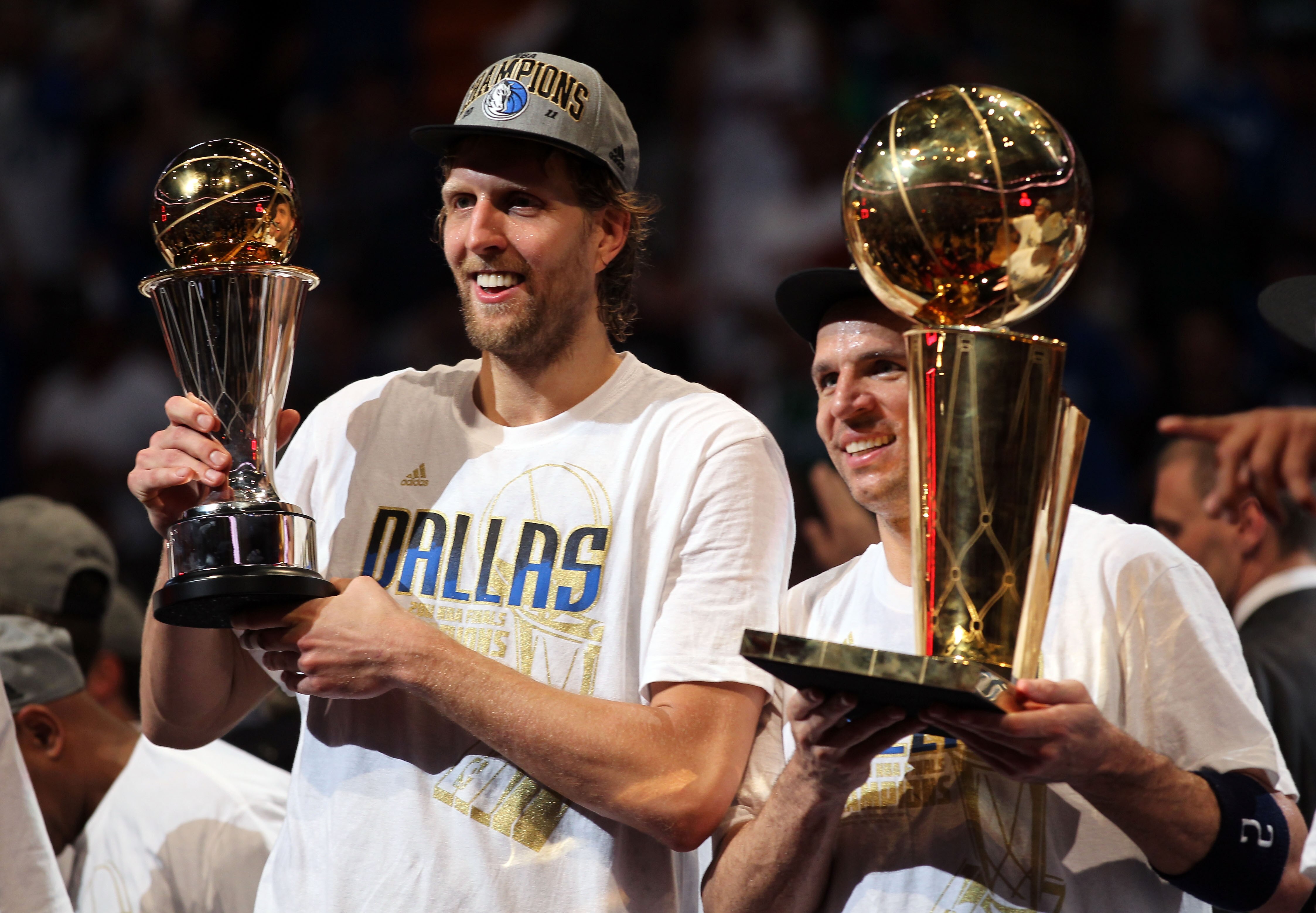 MIAMI, FL - JUNE 12:  (L-R) Finals MVP Dirk Nowitzki #41 and Jason Kidd #2 of the Dallas Mavericks celebrate with the Larry O'Brien trophy after the Mavericks won 105-95 against the Miami Heat in Game Six of the 2011 NBA Finals at American Airlines Arena